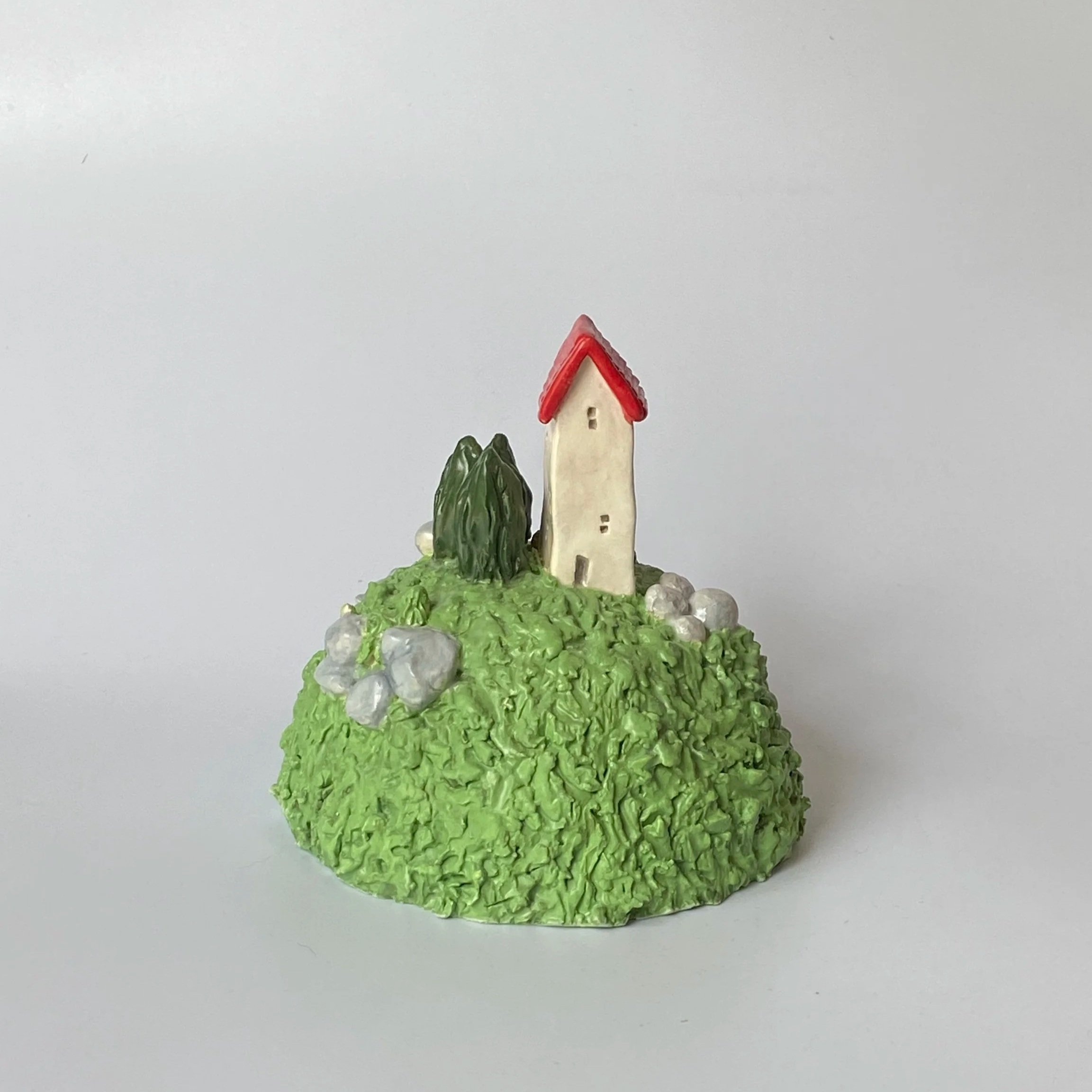 Little House on a Hill w/ rocks and logo inset. 2025.
Glazed and Underglazed Ceramic.
H 11cm W 10cm.