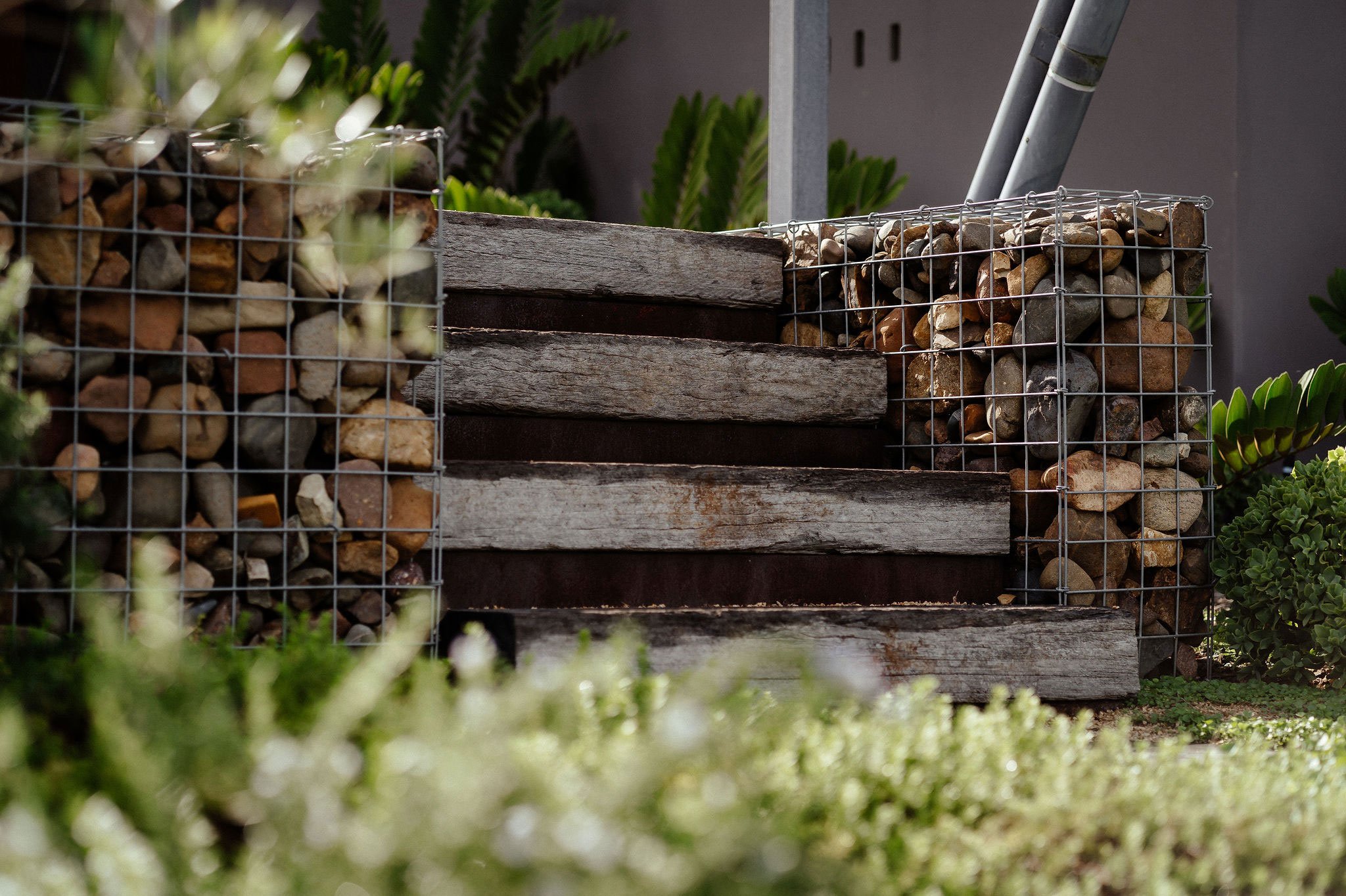 TG-Gardenscapes_Our-Projects_27-Ridgeway-Crescent_Retaining-Wall-with-Rocks-Wooden-Steps.jpg