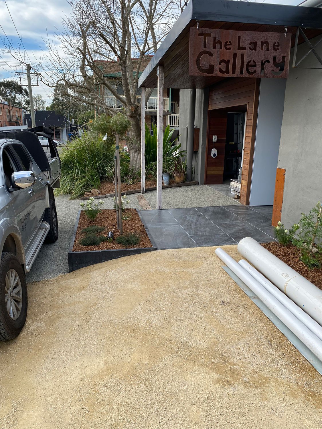 TG-Gardenscapes_Our-Projects_Waratah-Warehouse_Raised-Garden-Beds-with-Paved-Walkway.jpg