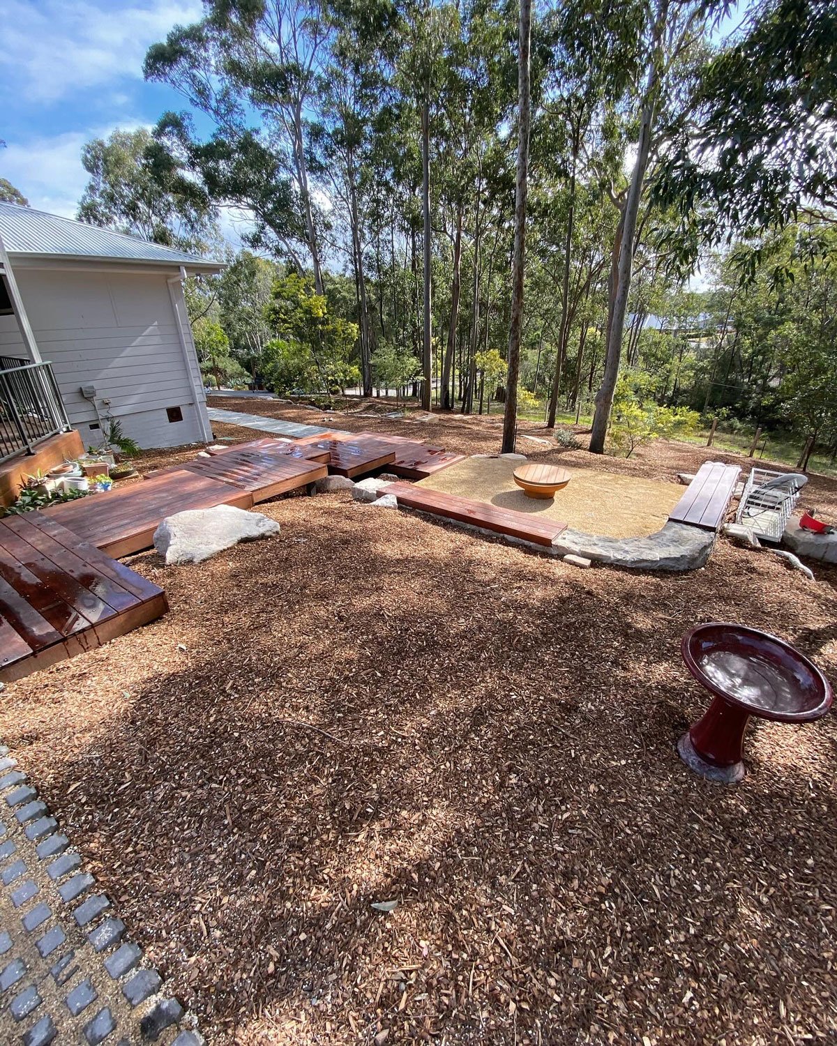 TG-Gardenscapes_Our-Projects_Lake-Forest-Way_Murrays-Beach_Wooden-Steps-with-Wood-Chips-with-Firepit-and-Bird-Bath.jpg