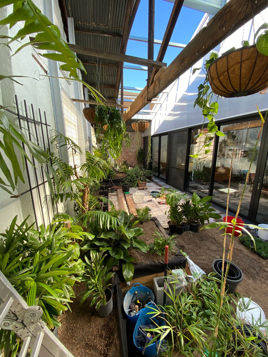 TG-Gardenscapes_Our-Projects_Waratah-Warehouse_Indoor-Raised-Garden-Beds-being-Created.jpg