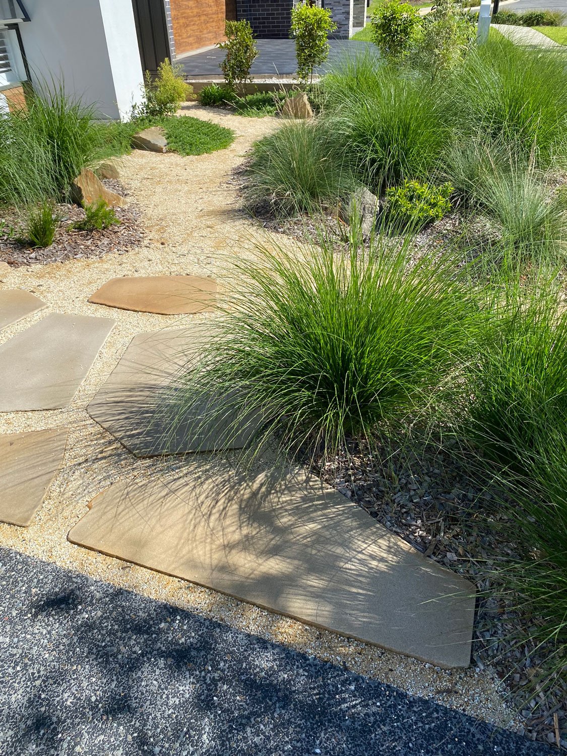 TG-Gardenscapes_Our-Projects_Edgeworth_Garden-with-Large-Stepping-Stones-with-Plants.jpg