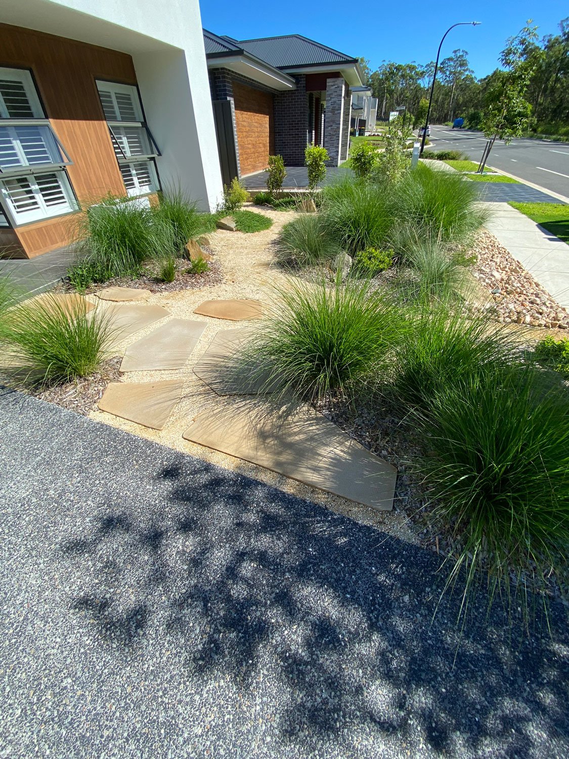 TG-Gardenscapes_Our-Projects_Edgeworth_Garden-with-Large-Stepping-Stones-with-Plants-in-front-of-windows.jpg
