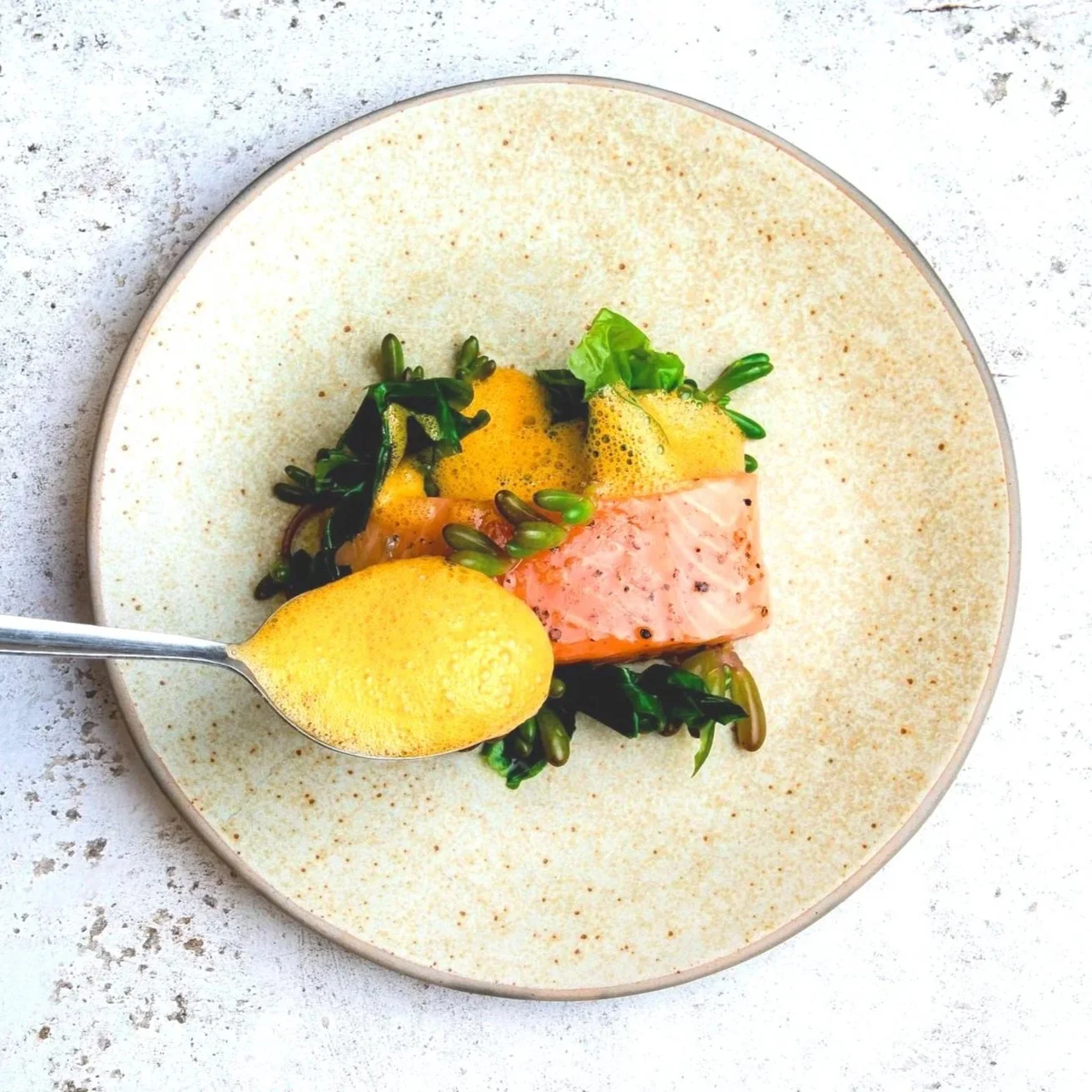 slow cooked salmon on sea beam bisque reduction