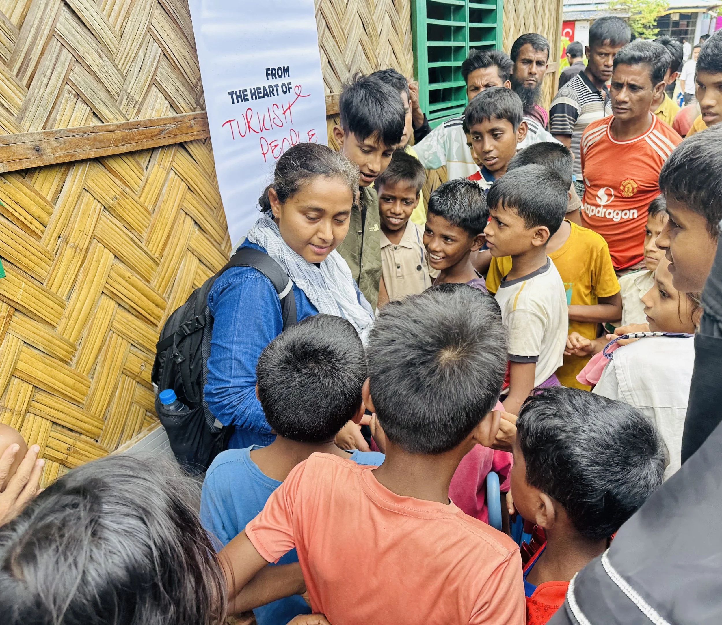 Hafsar Tameesuddin with young people in a Rohingya refugee camp