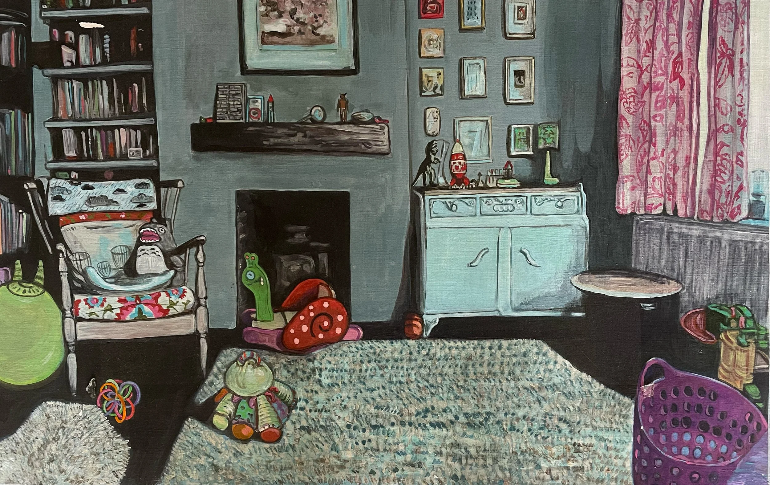 A cozy living room with a bookshelf, a chair with a Totoro plush toy, cardboard snail toys, a small plush doll, a fireplace, a white cabinet, pink curtains with floral patterns, a purple laundry basket, and various small decorative items.