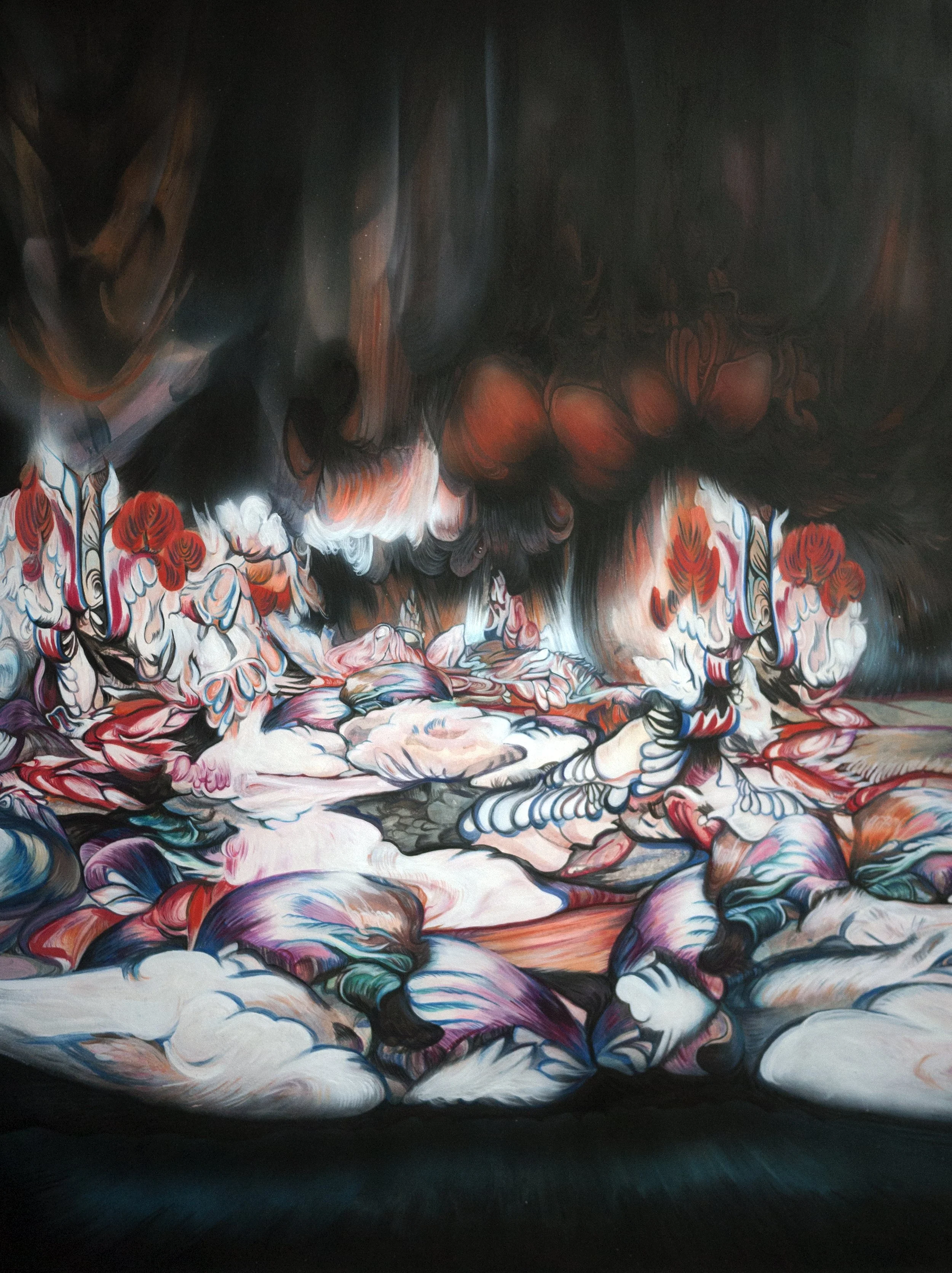 Abstract painting with swirling patterns in shades of red, pink, blue, black, and white.