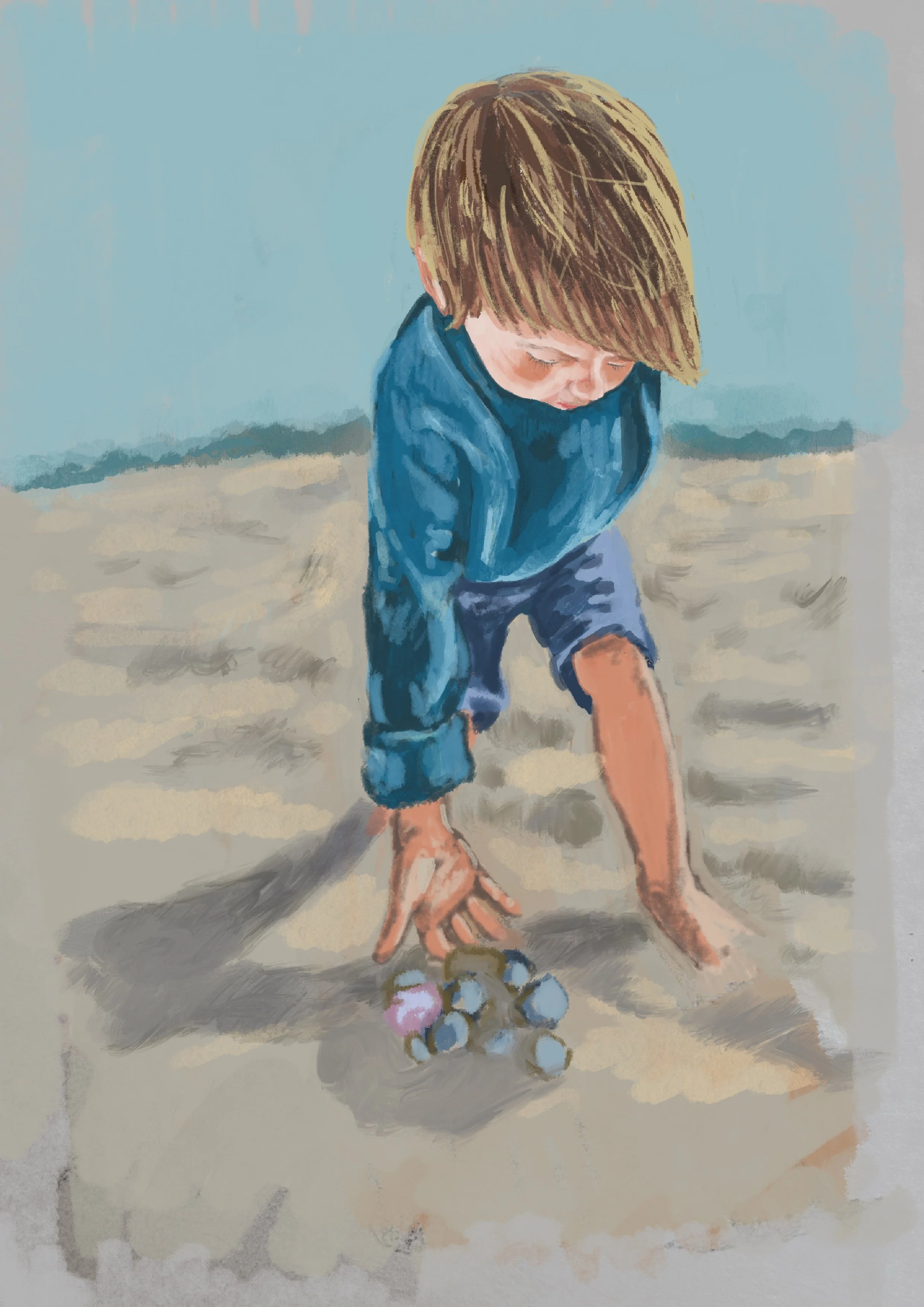 A young boy with brown hair, wearing a blue jacket and shorts, is crouched on a sandy beach playing with a pile of small shells or stones.
