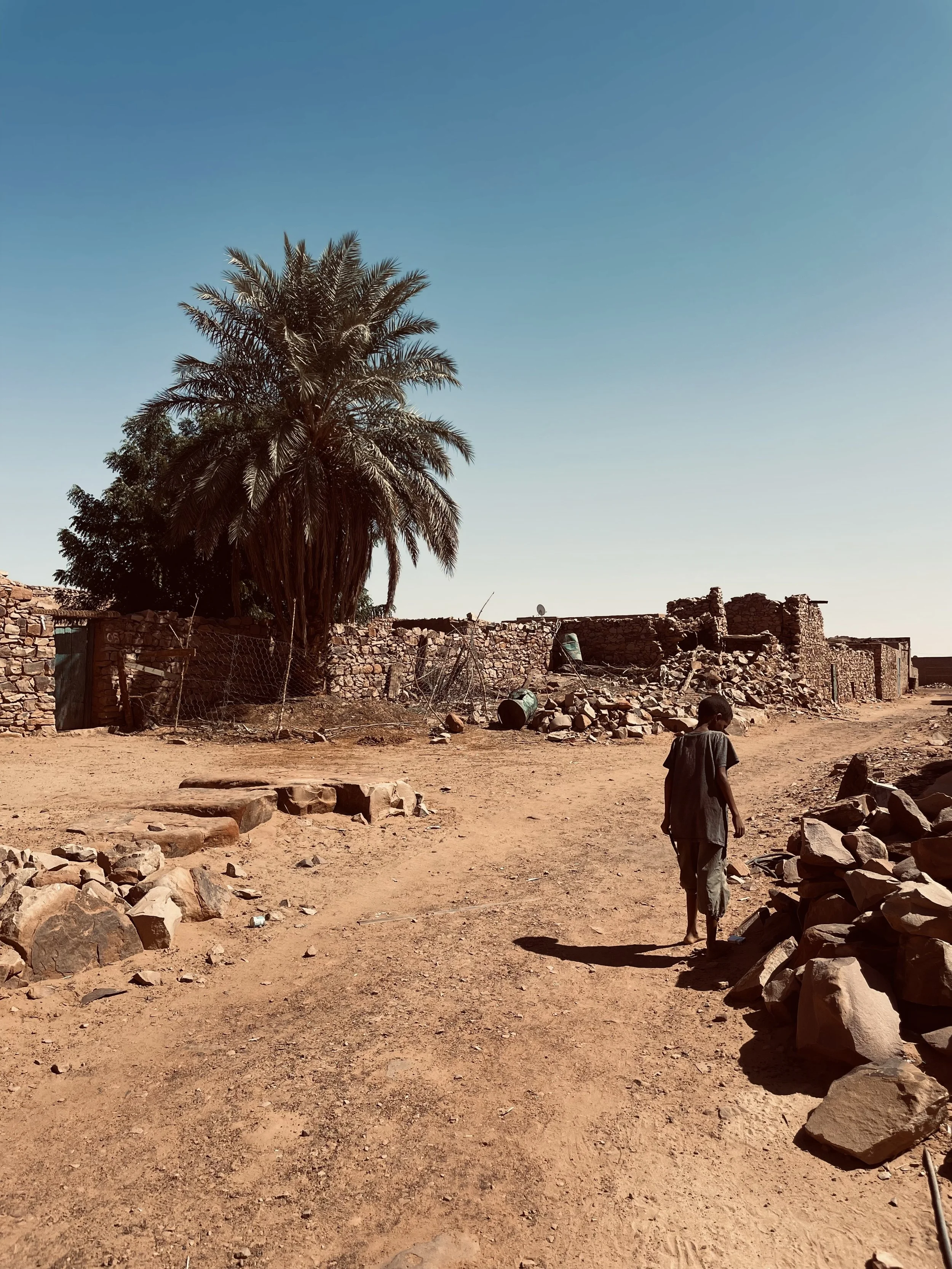 Kid walking without shoes in Ouadane in Mauritania