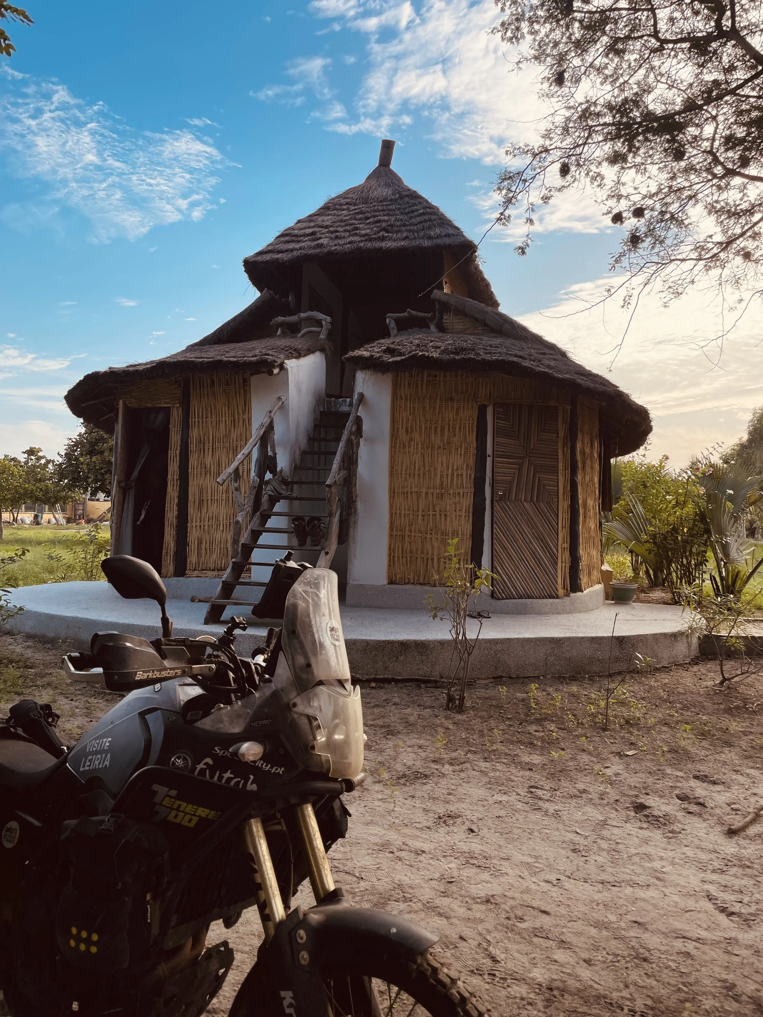 Yamaha Ténére 700 motorcycle with huts in Le Kibalaou, Cap Skirring, Senegal