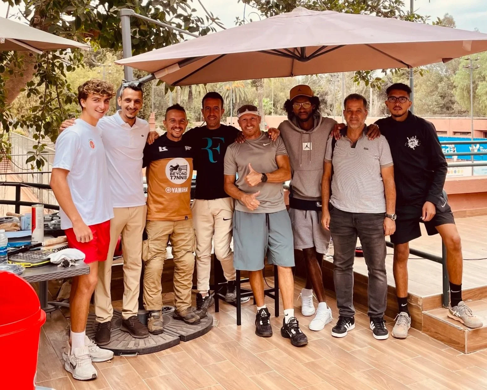 João Beltrão founder of Beyond T7nnis in a group picture in Riad Club in Rabat, Morocco