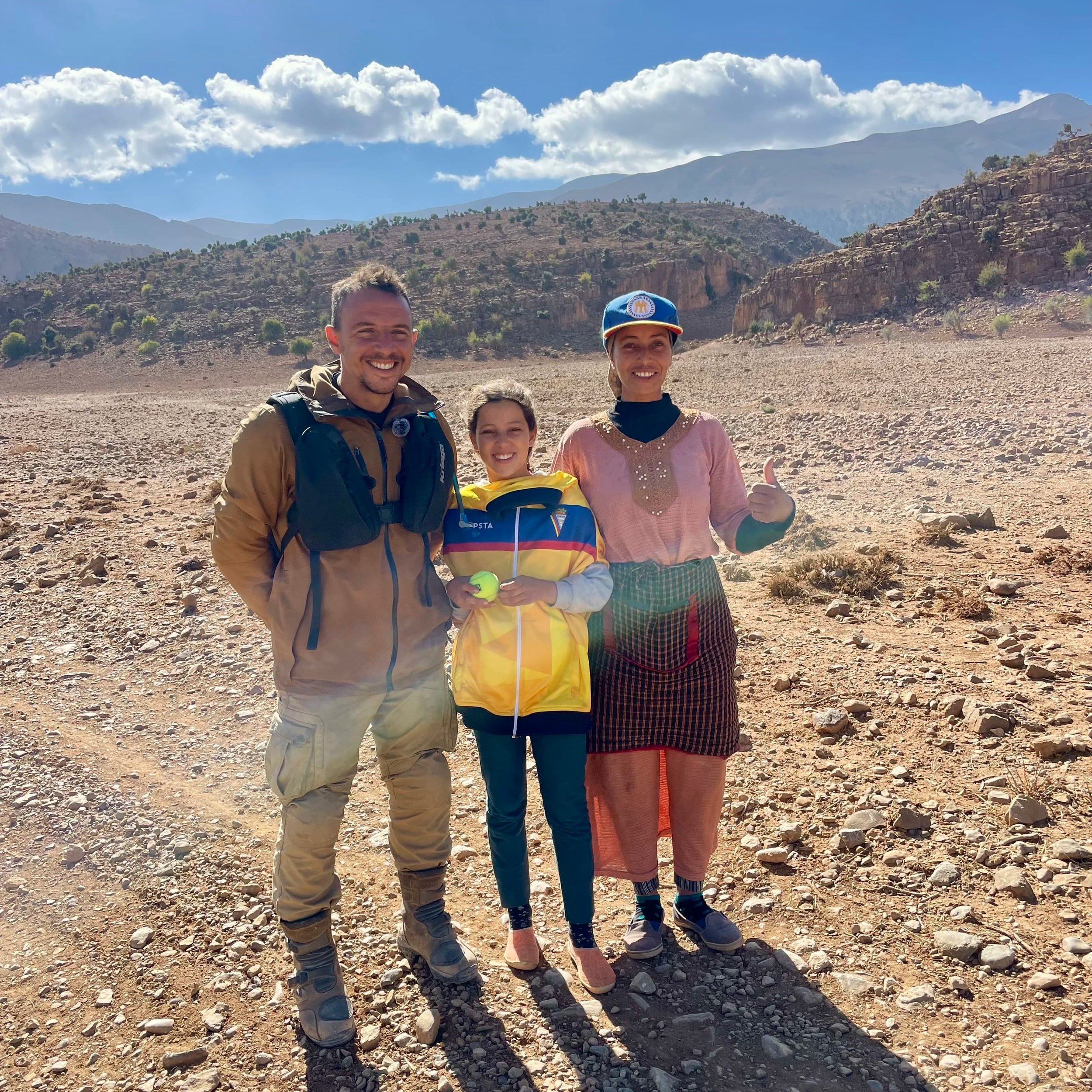 João Beltrão founder of Beyond T7nnis donating tennis ball and clothes to a girl close to cirque du jaffar in Morocco during a Beyond T7nnis mission