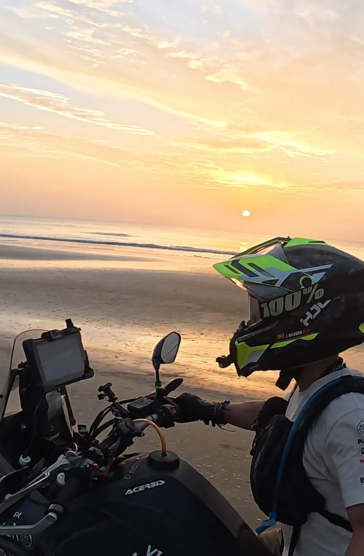 João Beltrão founder of Beyond T7nnis riding his Yamaha Ténére 700 motorcycle on the beach in Cap Skirring, Senegal