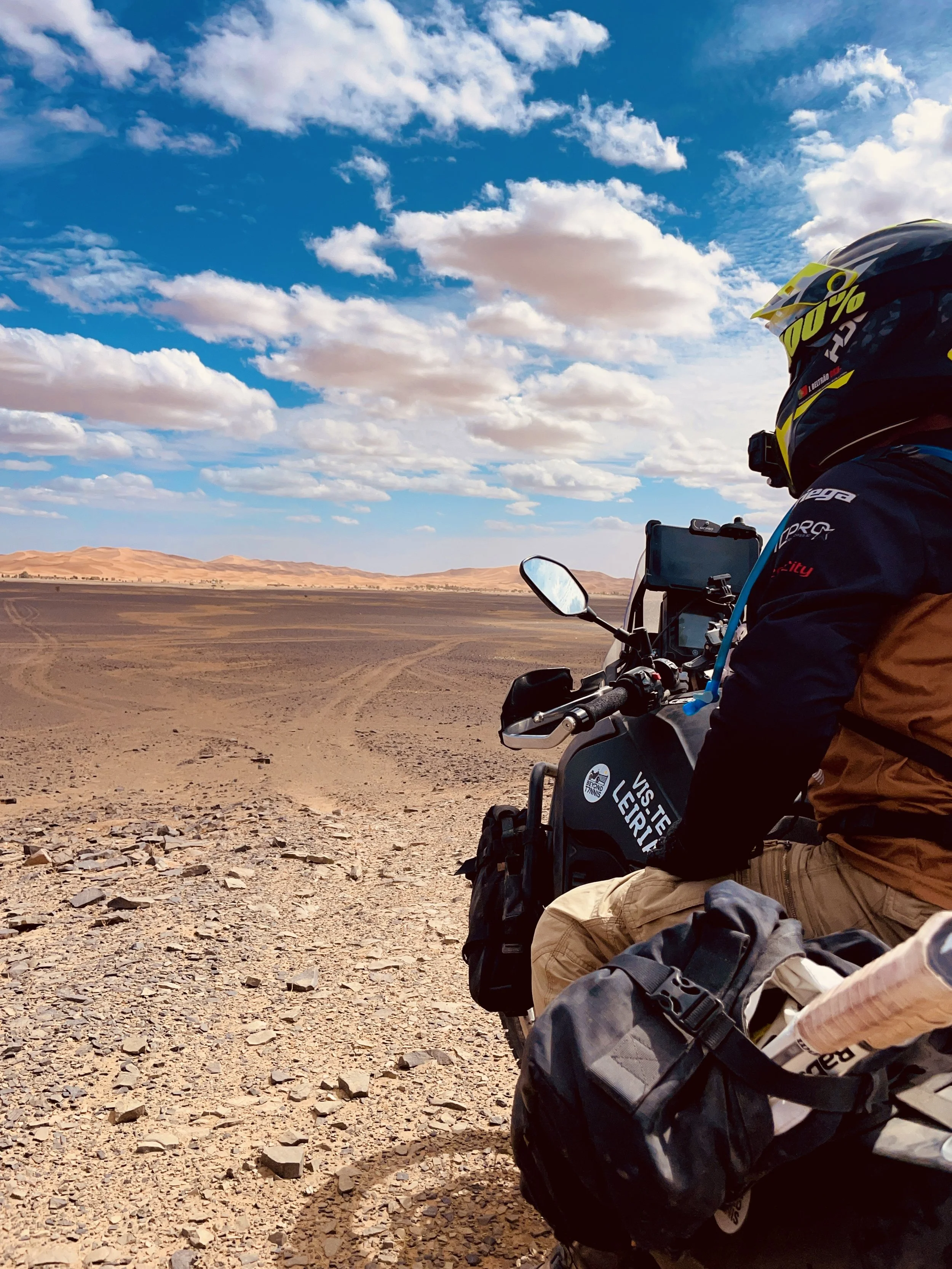 João Beltrão founder of Beyond T7nnis with his Yamaha Ténére 700 motorcycle in the sahara desert 