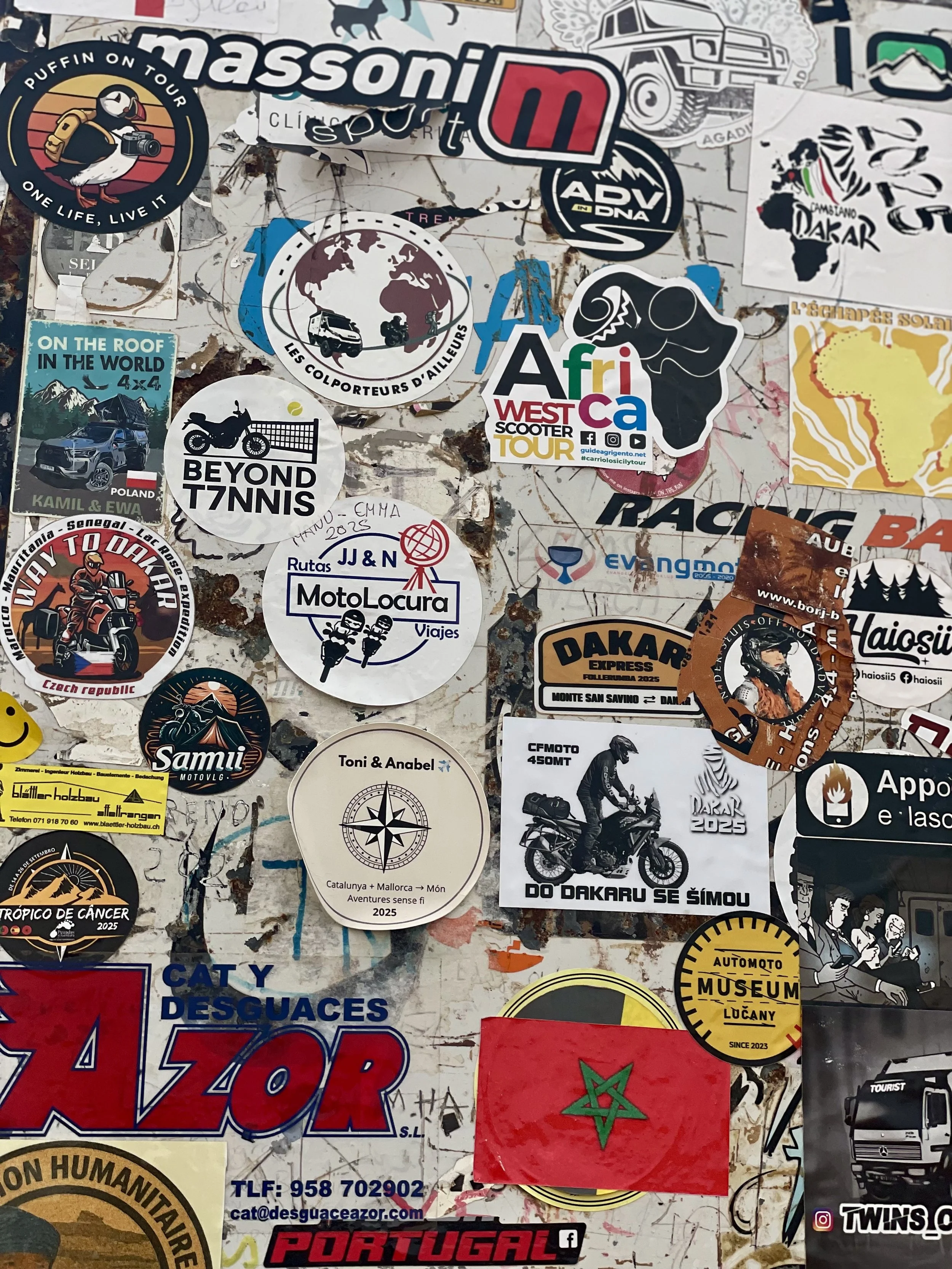 Beyond T7nnis sticker at a road sign with motorcycle stickers