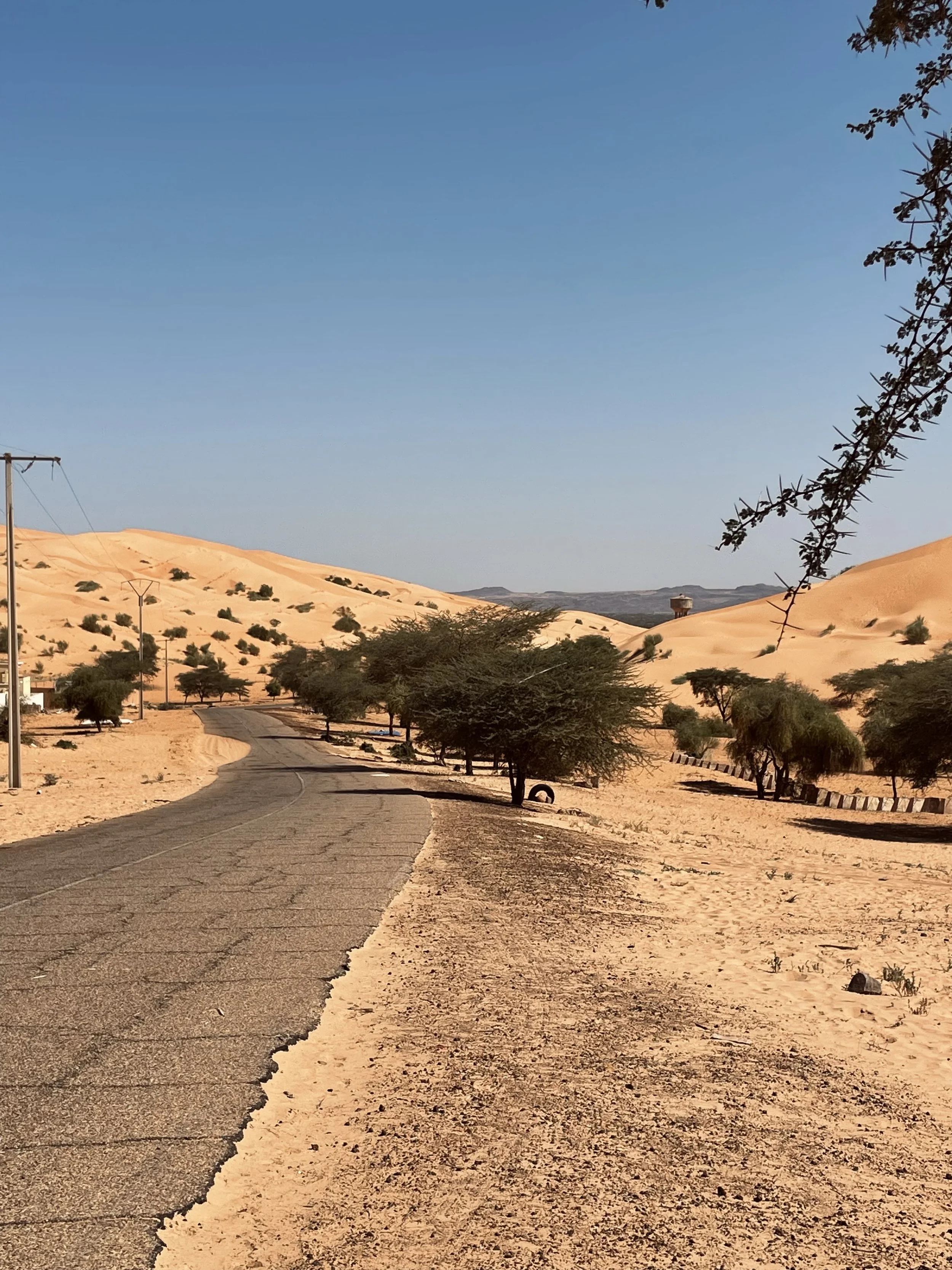 Road crossing endless sand dunes in Mauritania
