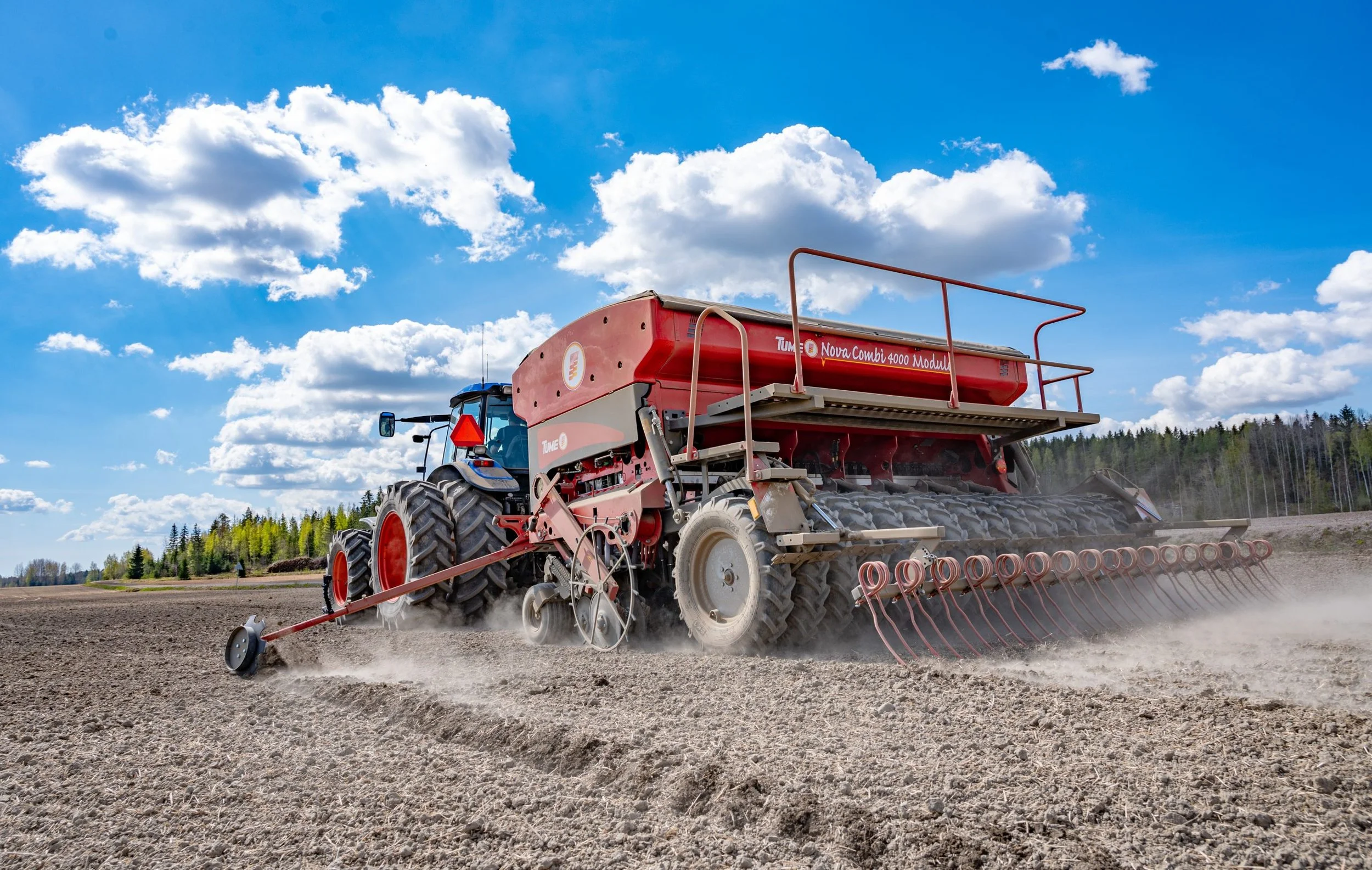 Nova Combi sowing while driving away from the camera