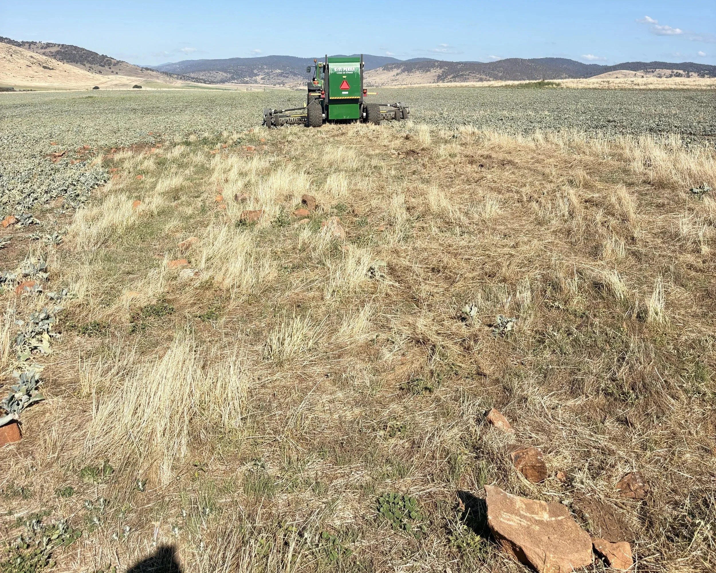 Australian farmer operating a KIVI-PEKKA stone picker on a mixed farming property in North West Tasmania