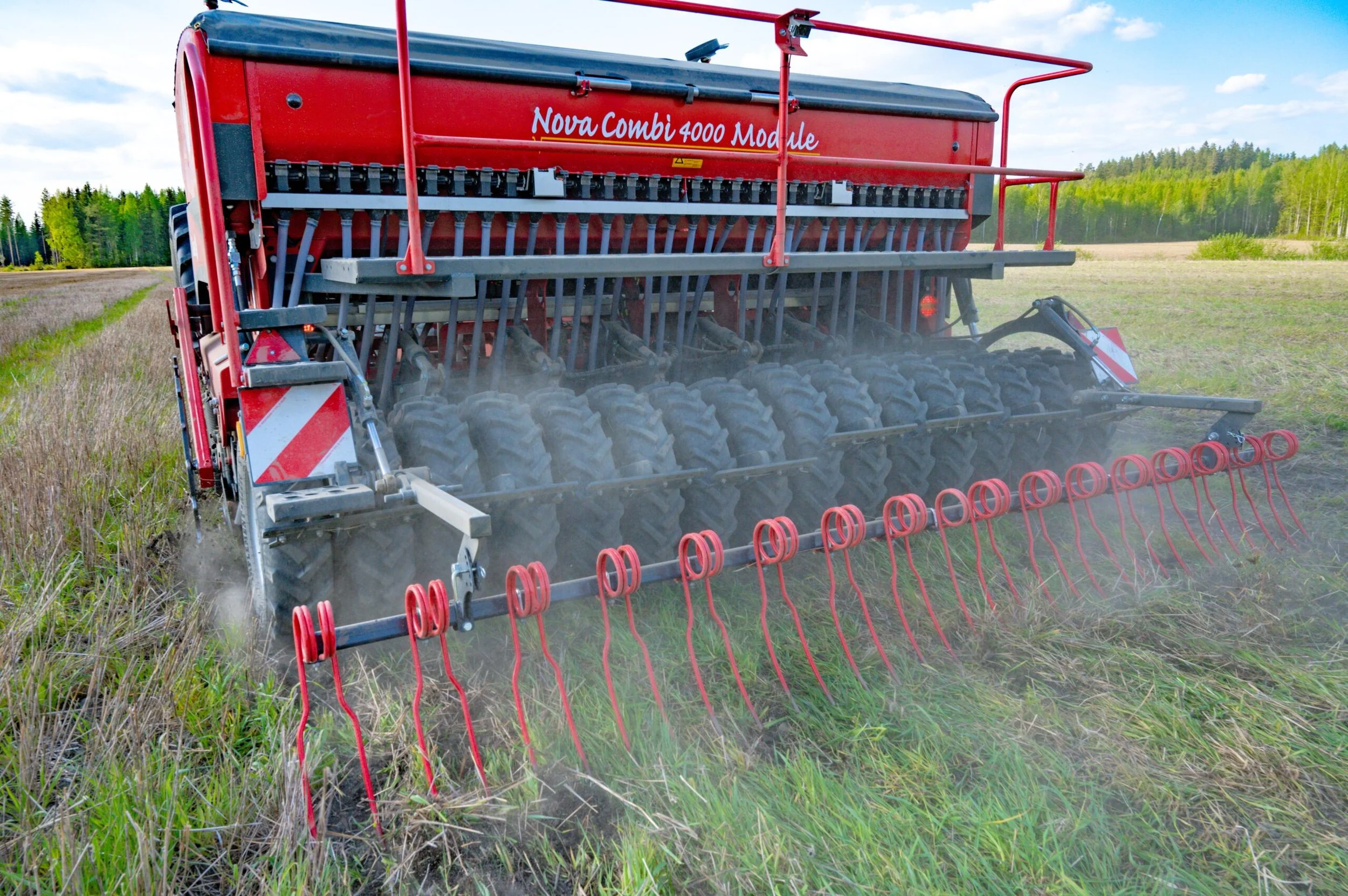 Nova Combi Sowing into pre-existing pasture as rear press wheels roll over sowing ground