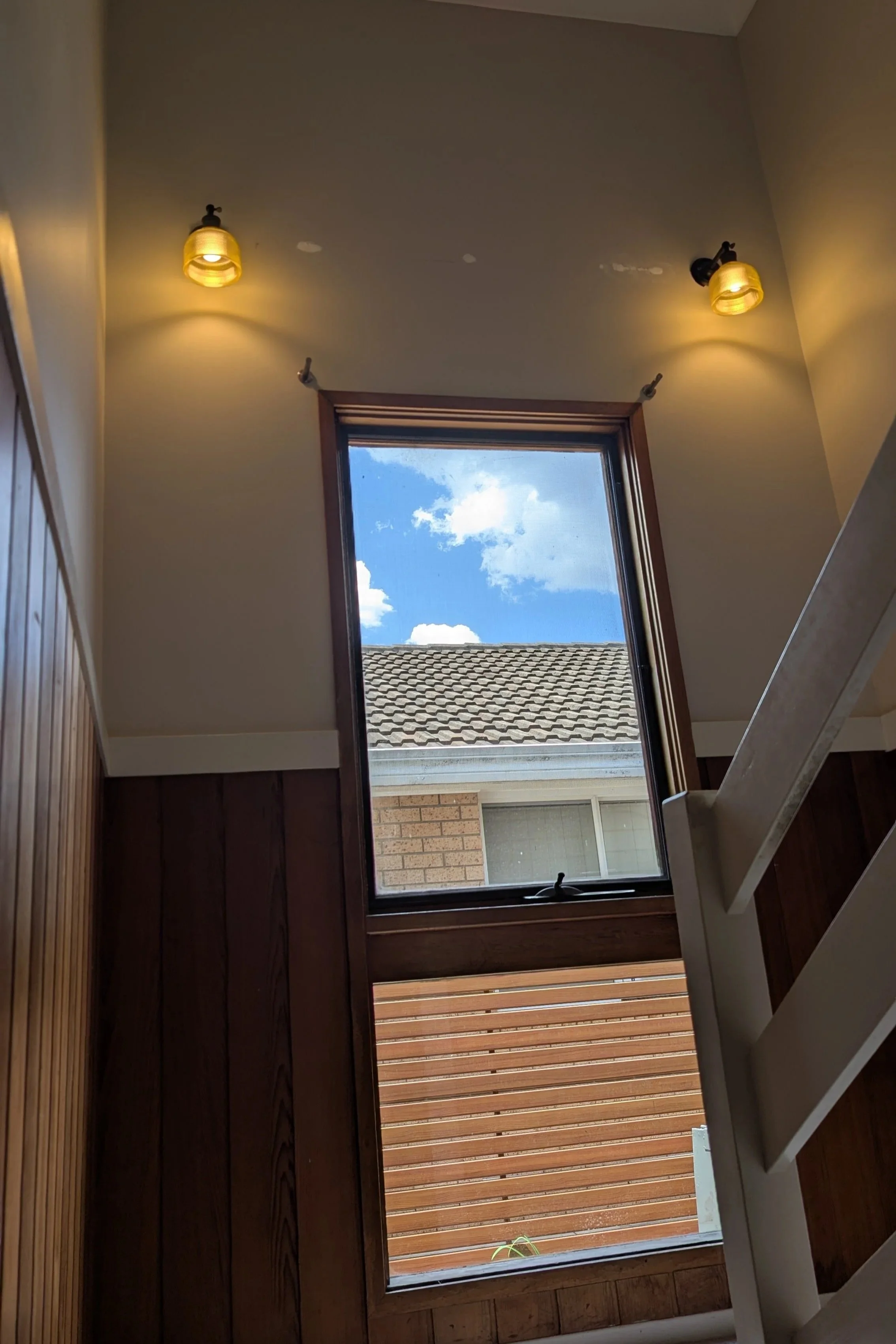 Two retro style wall lights in stairwell