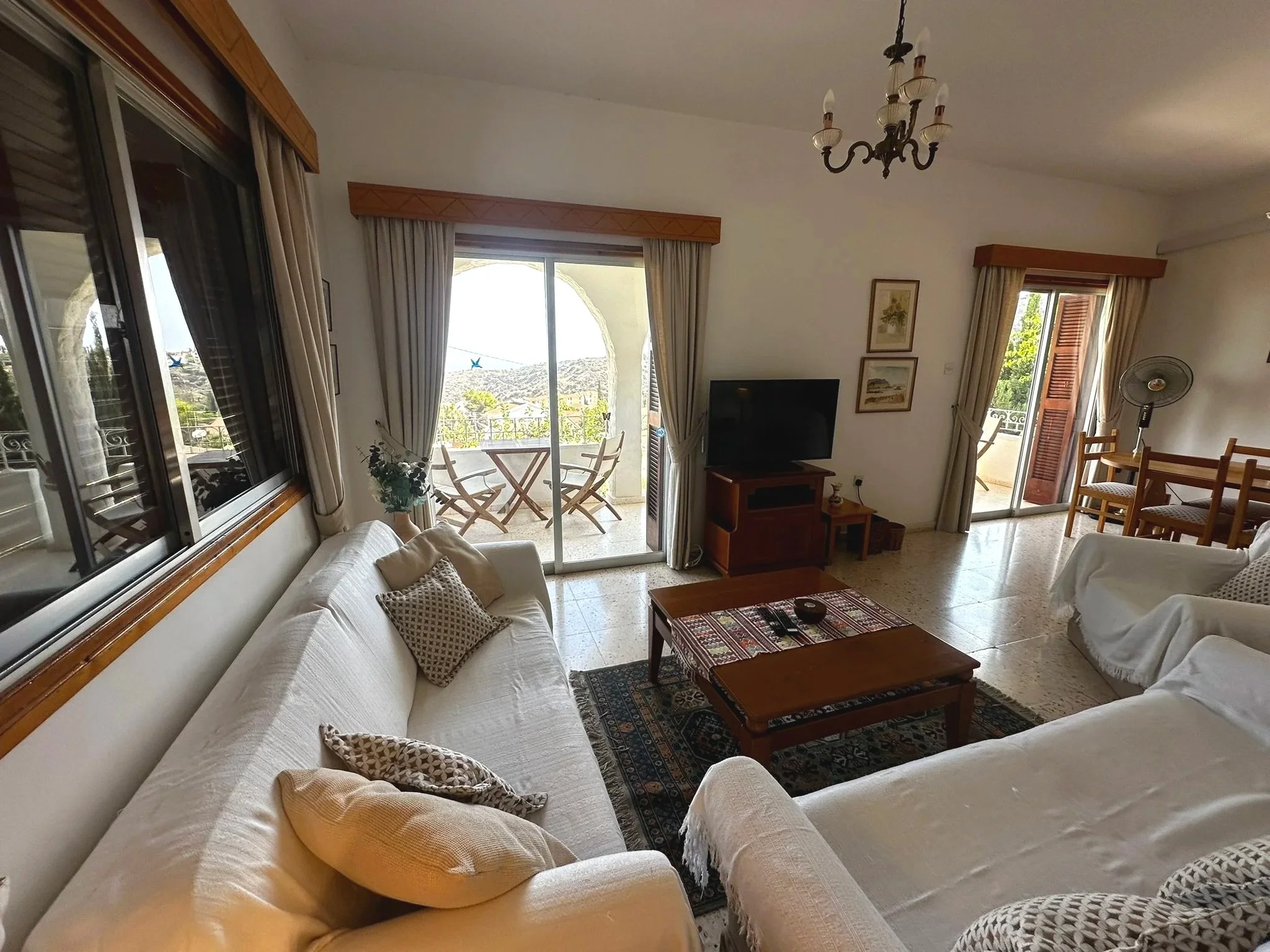Margarita Villa sitting room with two windows leading to the balcony