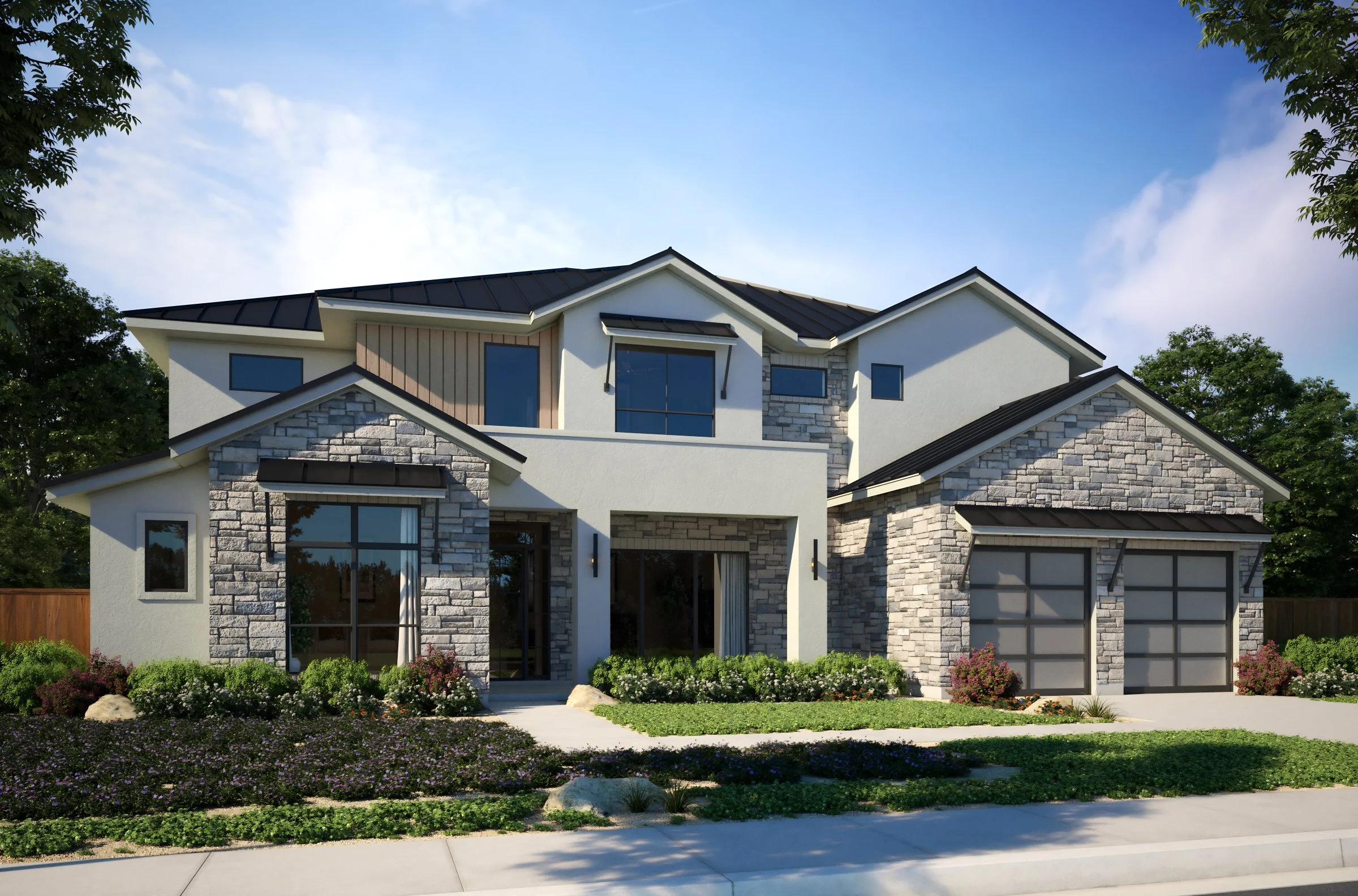 A modern two-story house with a combination of stone and white siding exterior, large windows, a black metal roof, and a well-maintained front yard with flowers and greenery.