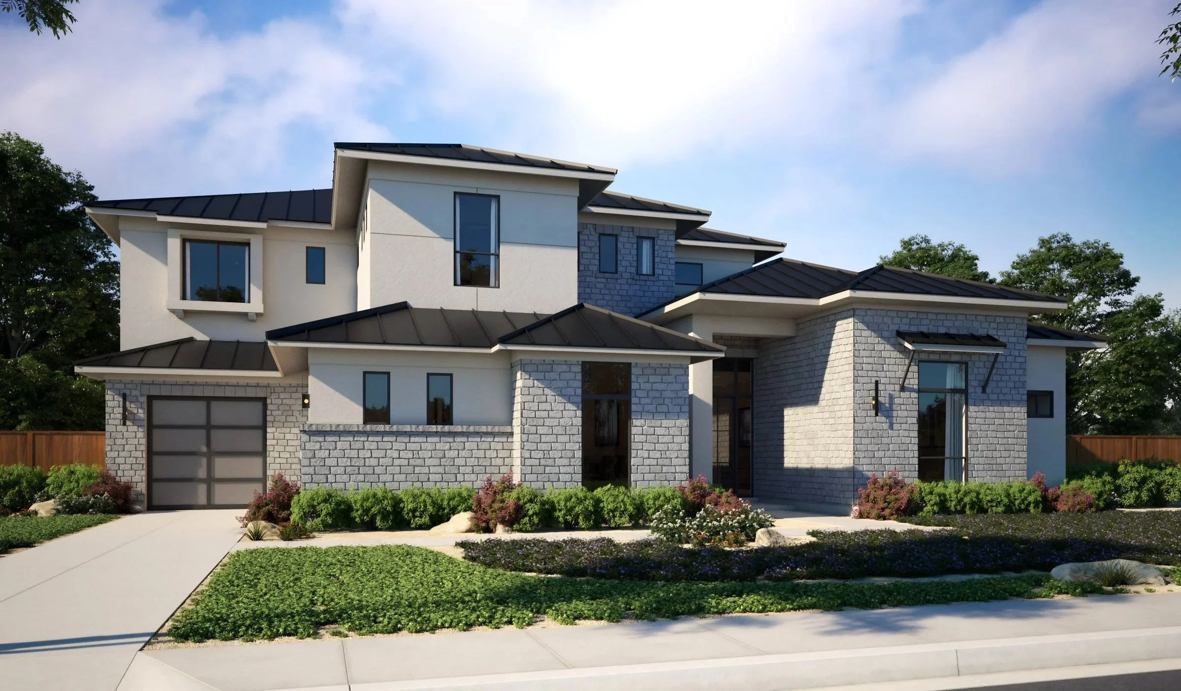 Modern two-story house with a mixed material exterior, including white stucco and gray brick, featuring a pitched black metal roof, large windows, a brick garage door, and manicured front yard with colorful shrubs and a concrete walkway.