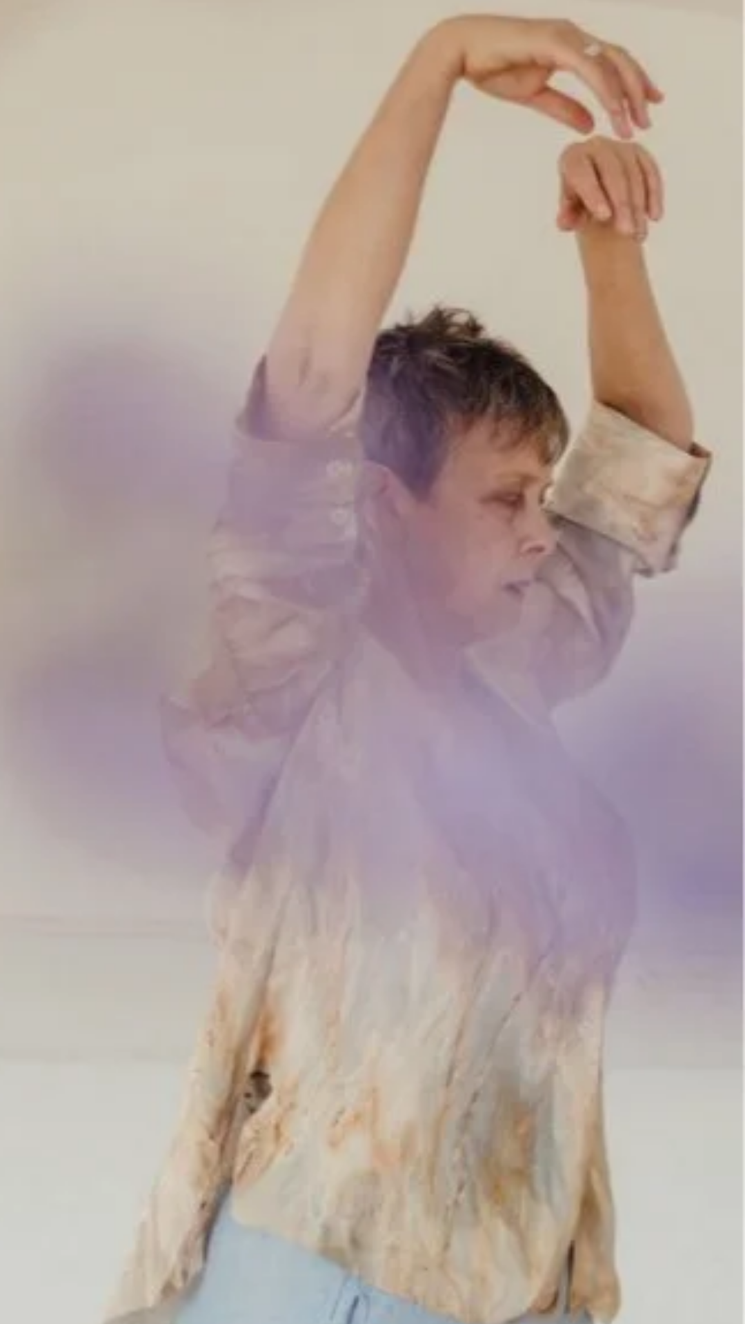 woman dancing arms lifted