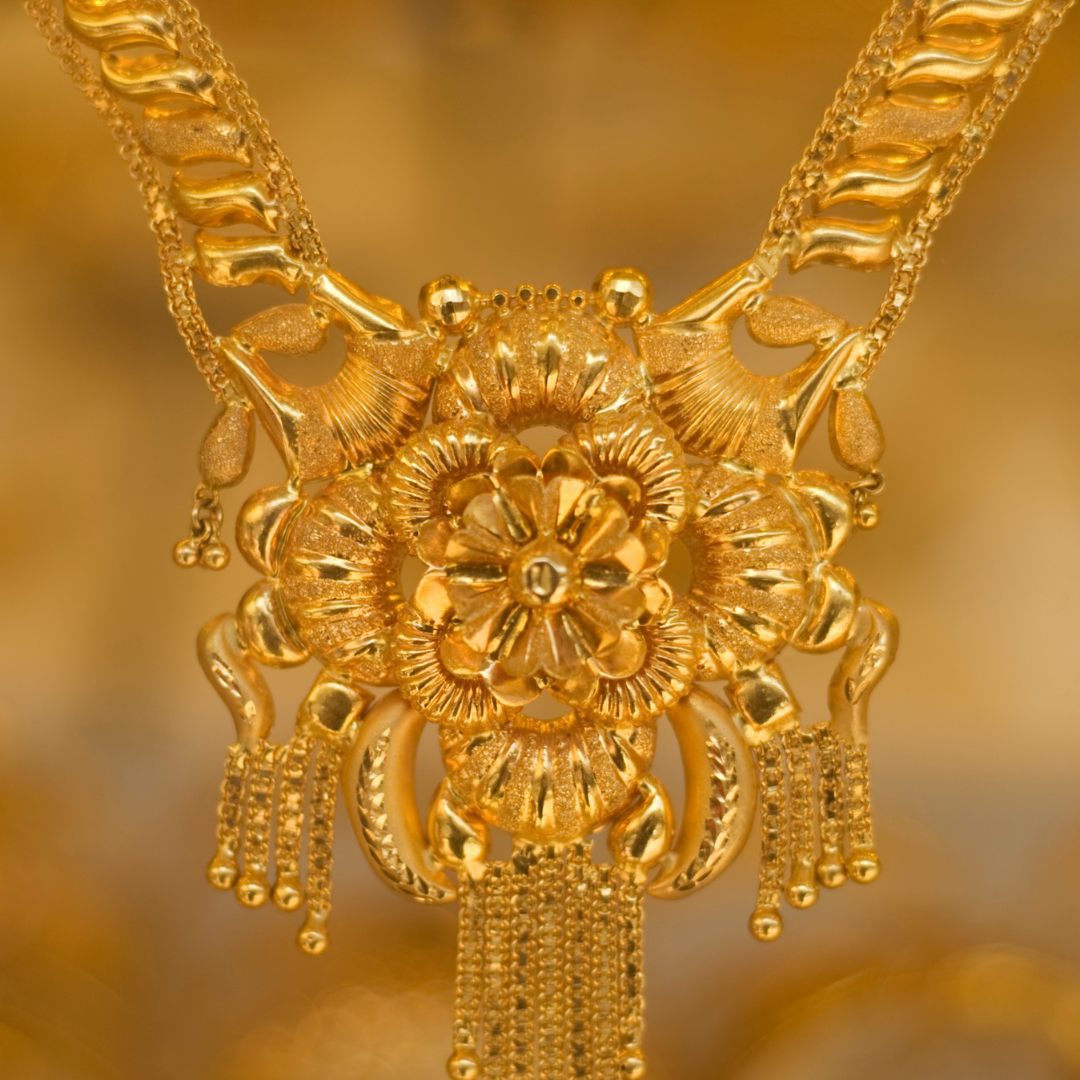 gold flower-shaped pendant