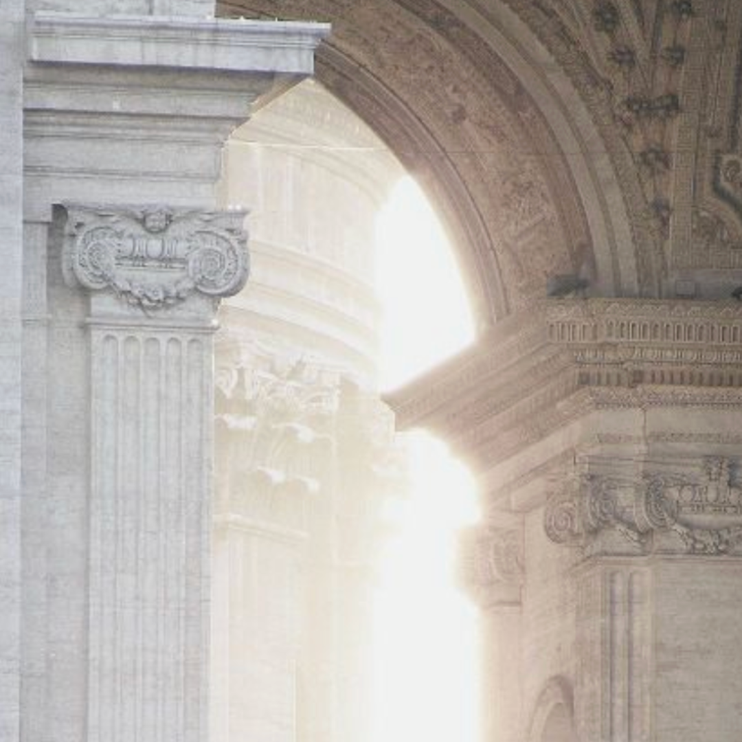 white stone pillar and archway