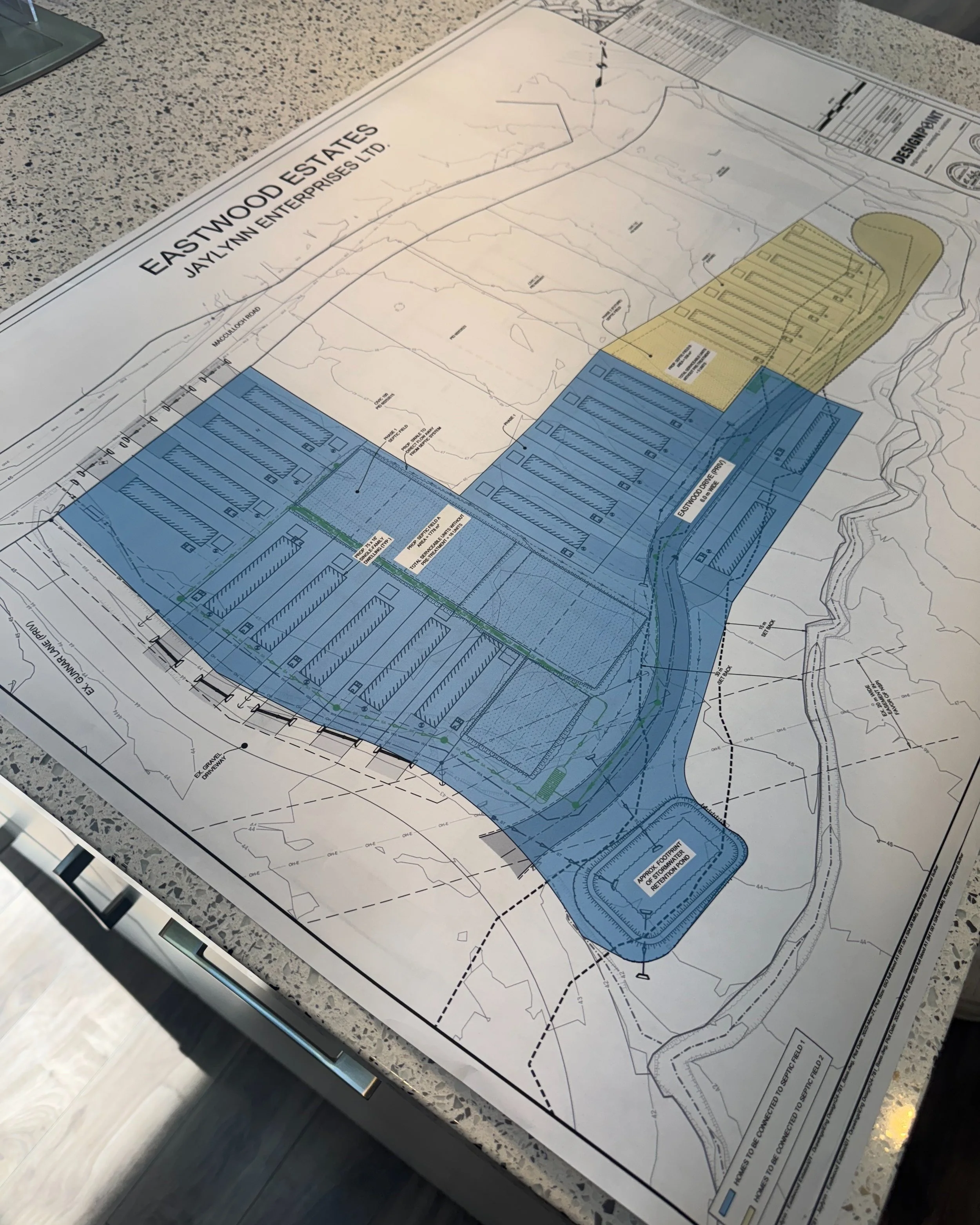 Site plan or blueprint for Eastwood Estates subdivision, showing layout of lots, roads, and boundary lines, with color coding and property details.