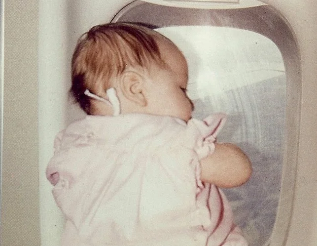 baby shannon looking out airplane window.jpg