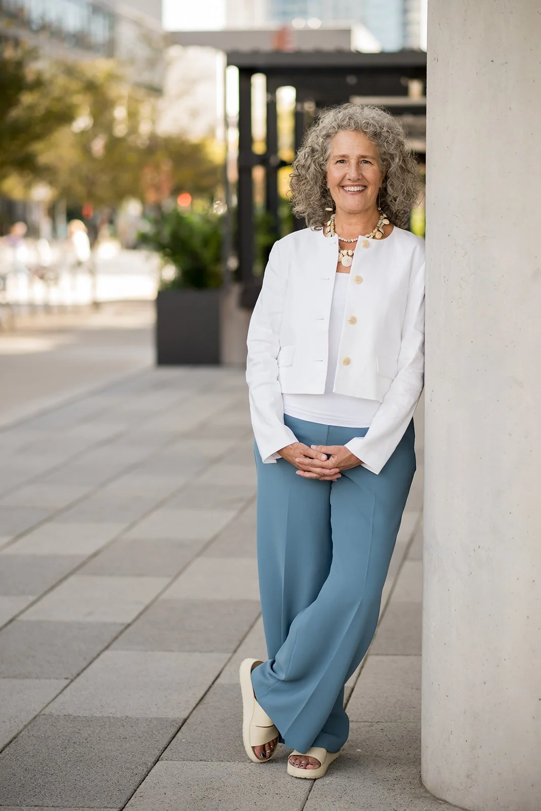 Photo of executive coach Ellen Lindsey standing in downtown Austin Texas.