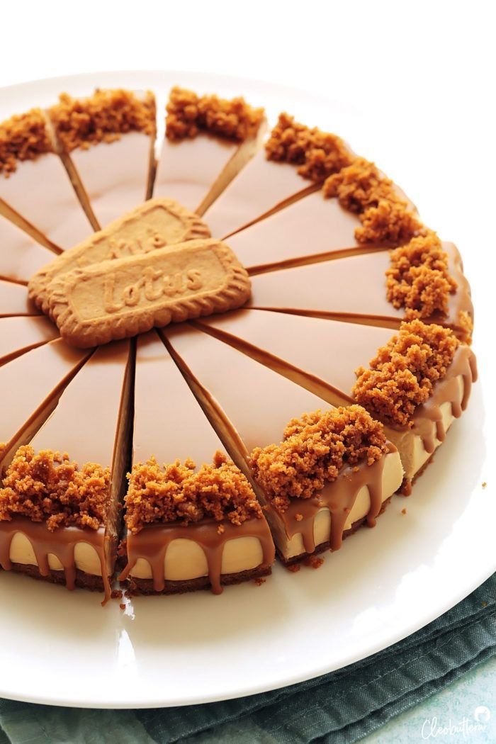Whole Biscoff cheesecake topped with crumbled cookies and caramel drizzle, garnished with Biscoff cookies
