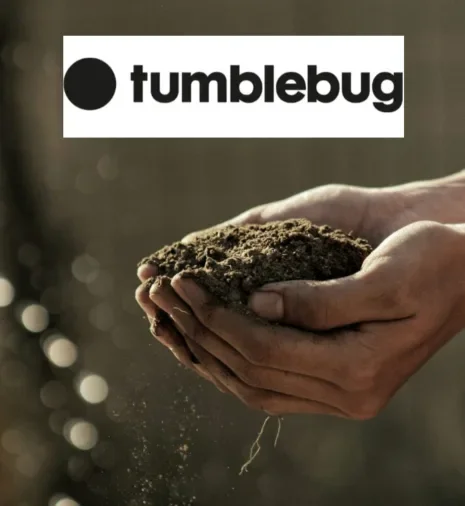 A pair of hands holding dirt or soil with a small root or sprout emerging from it, above the Tumblebug logo.