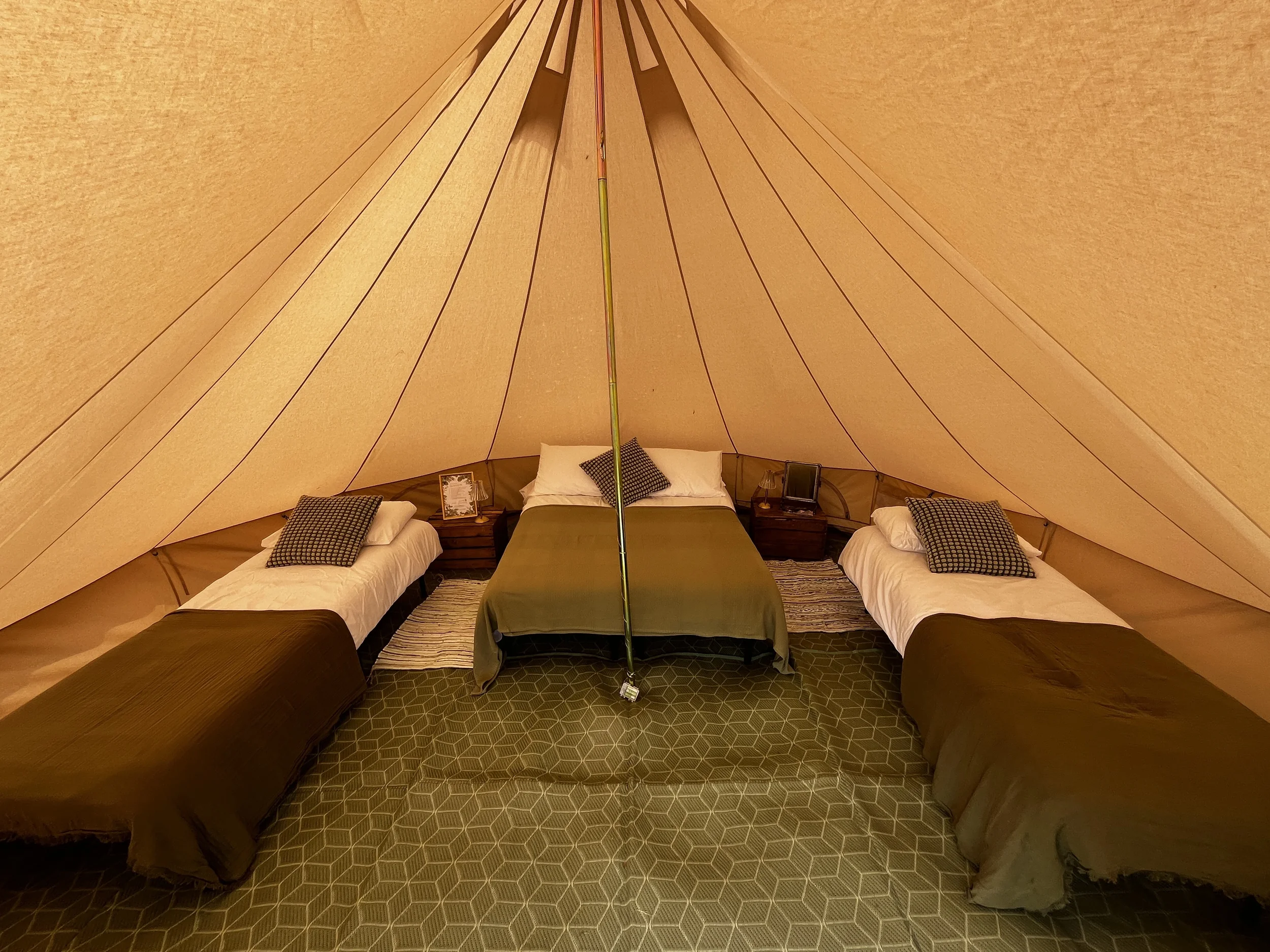 enwild glamping 5m bell tent with 1 double and 2 single beds.webp (Copy)