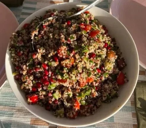 a healthy colourful bowl of quinoa salad made with local seasonal produce
