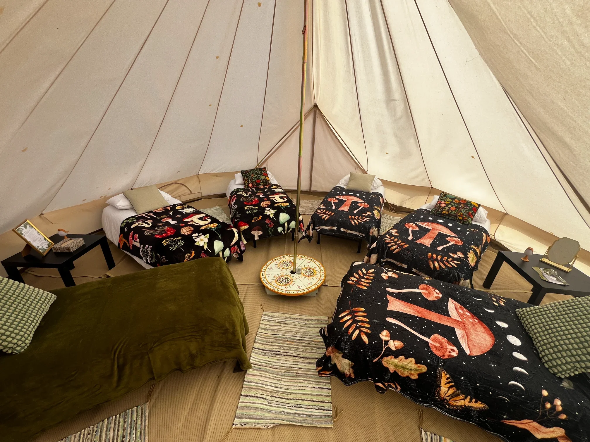 6 metre bell tent with 6 single real beds for larger groups