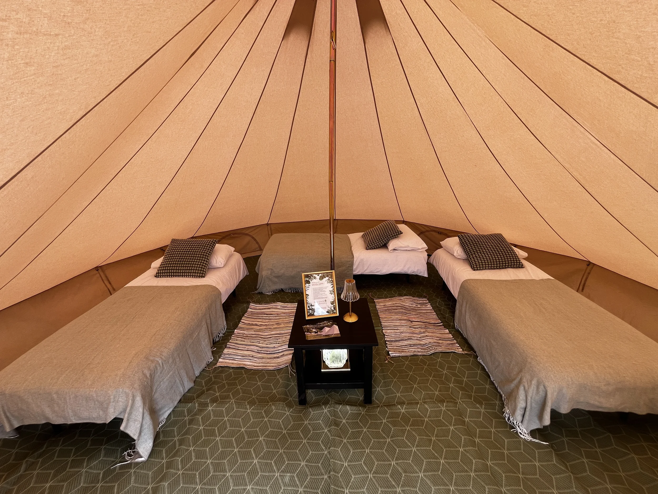 enwild glamping 5m bell tent with 3 single bed.webp