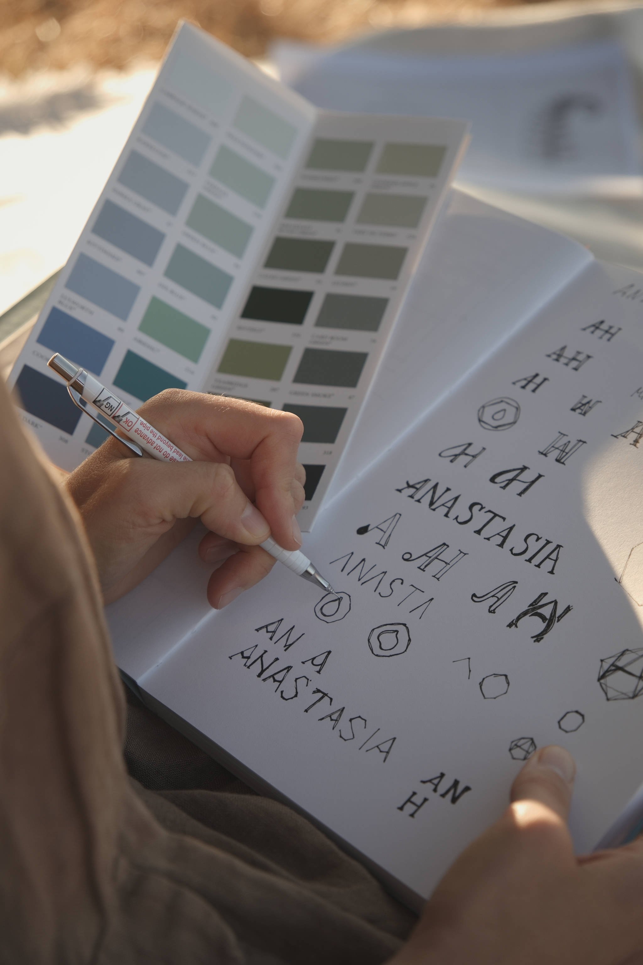 Maria Höfflin, the founder of the mindful brand design studio The Brand Flourist, is sketching a logomark for a women's wellbeing mentor.