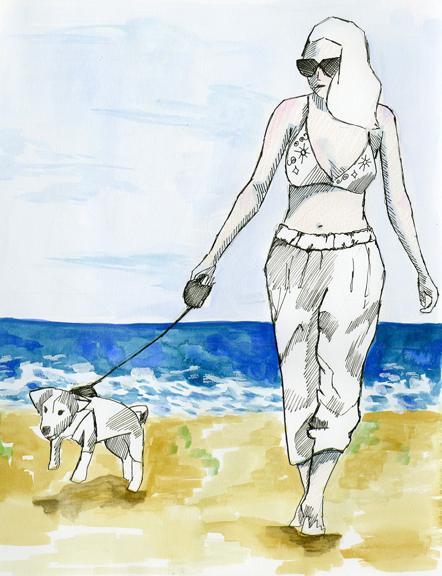 A woman in a bikini top, baggy pants, and sunglasses walking a dog on the beach. The background shows the ocean and a cloudy sky.