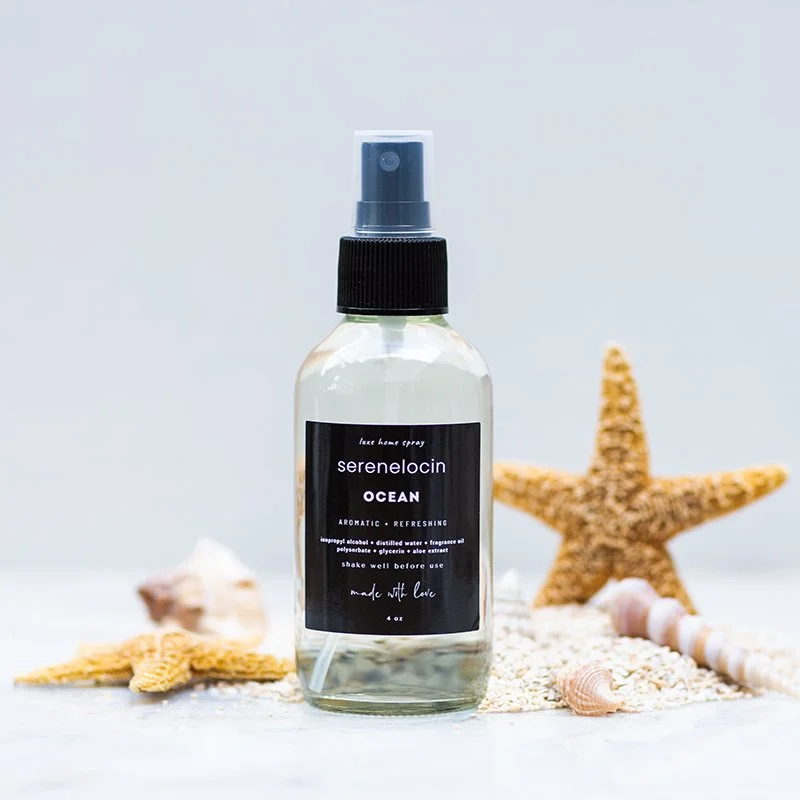 A spray bottle labeled 'Serenelocin Ocean' with a background of starfish and seashells.
