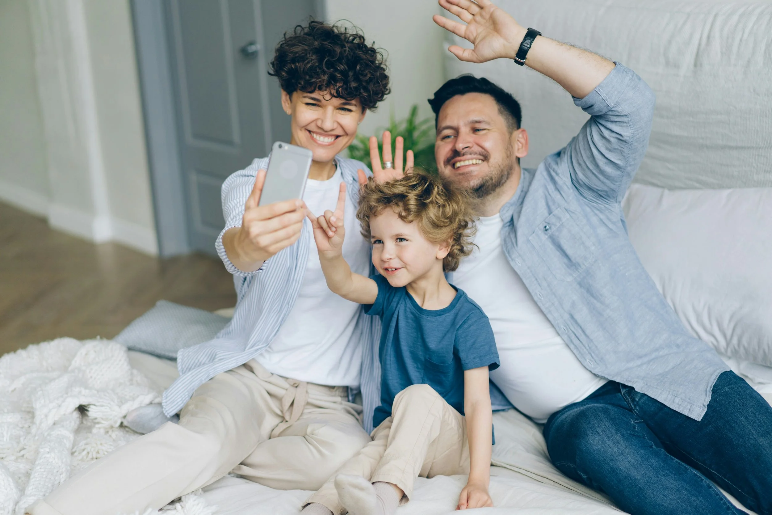 Happy family capturing a joyful moment together — Mohr to Life helps preserve these memories in books.