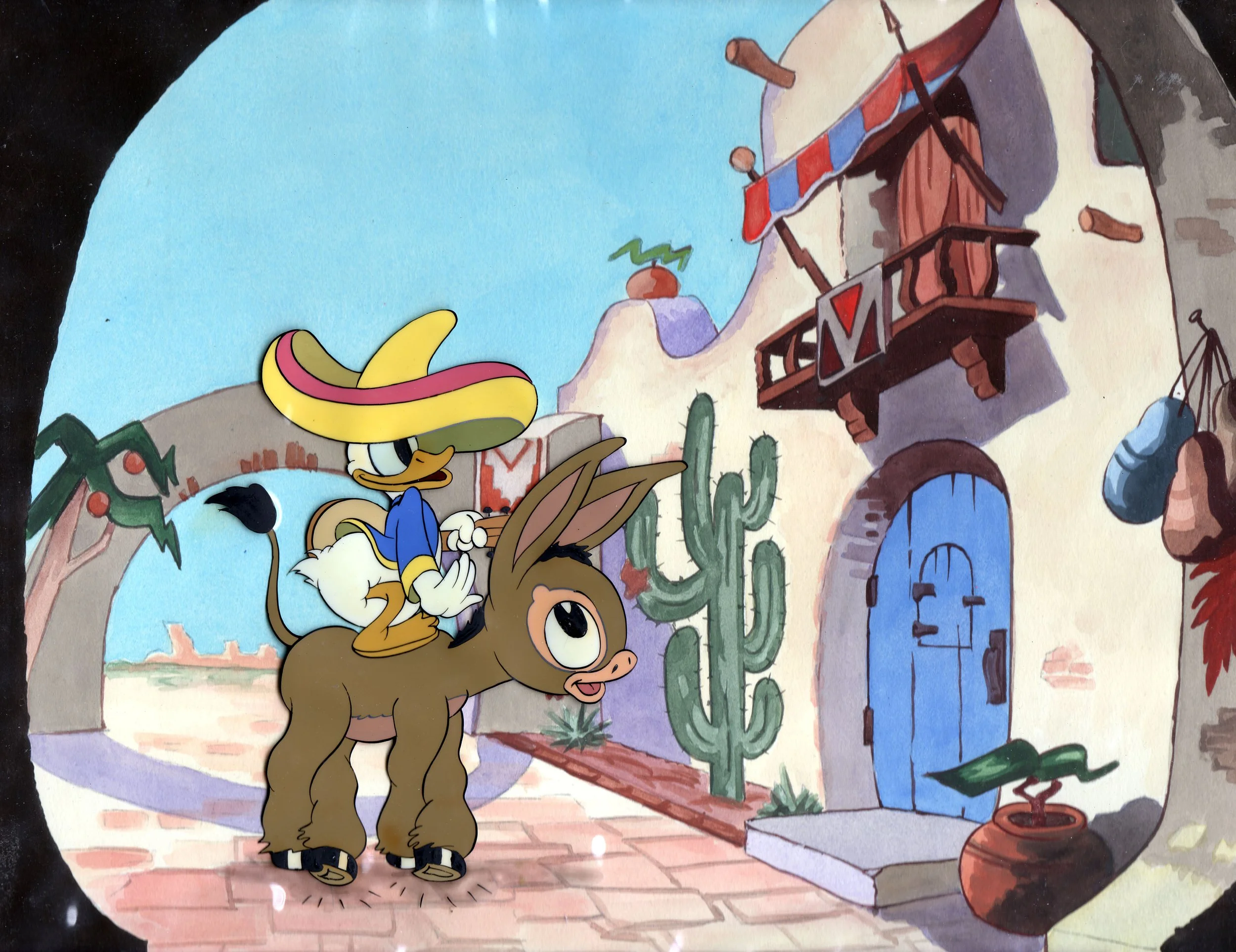 Cartoon scene with a donkey carrying a duck wearing a sombrero riding through a desert town with cacti, a blue door, and adobe-style buildings.