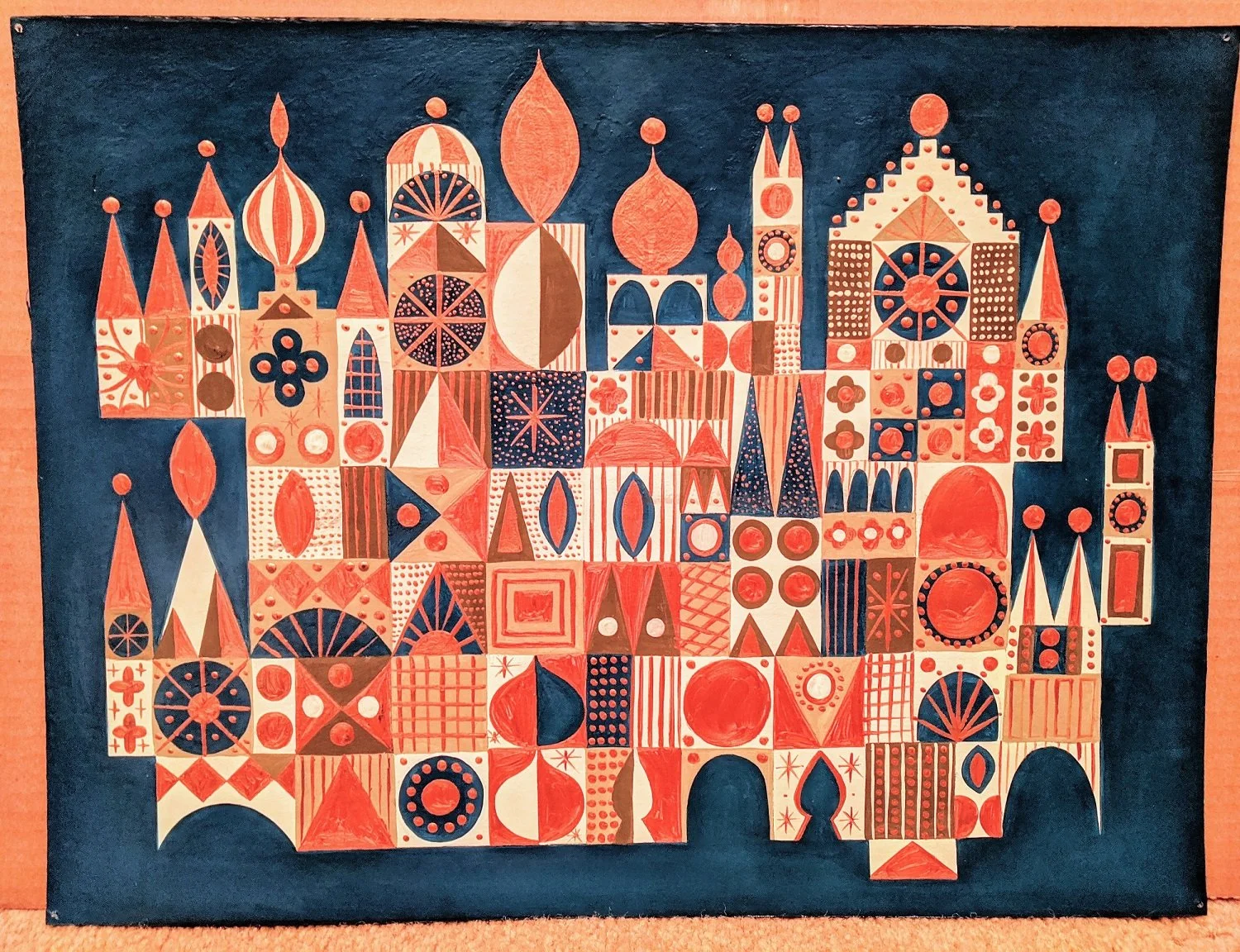 Colorful abstract illustration of a cityscape resembling Saint Basil's Cathedral in Moscow, with geometric shapes and patterns in shades of red, white, blue, and beige against a dark background.