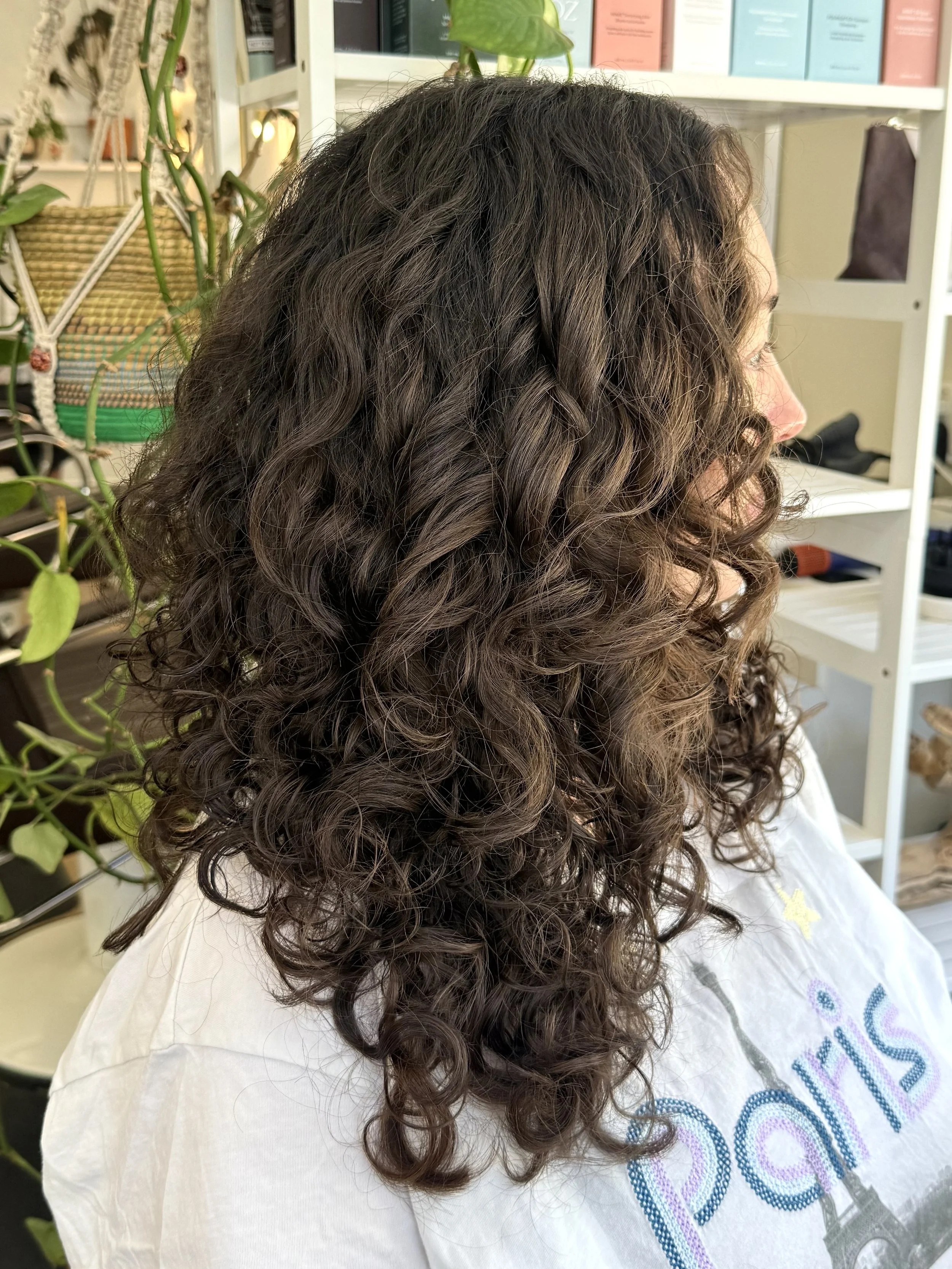 Curly Brunette Haircut by Emma Storey at Coven Beauty Collective in Midtown Sacramento, CA