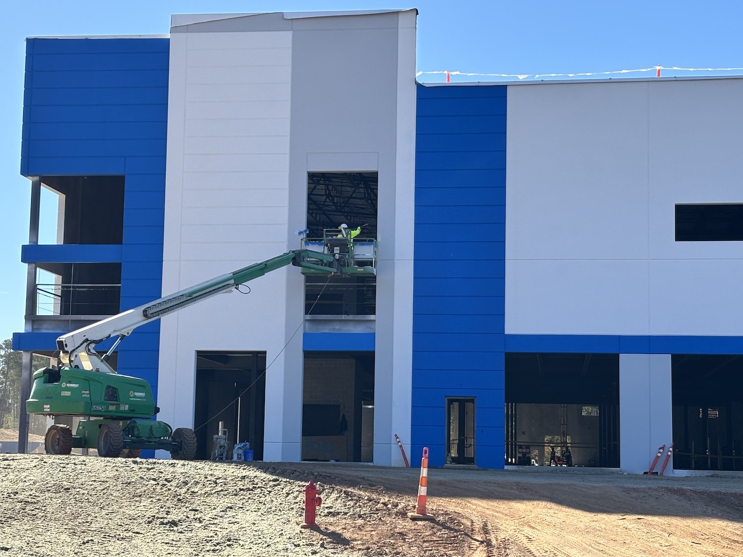 exterior commercial building painting in blue white and grey