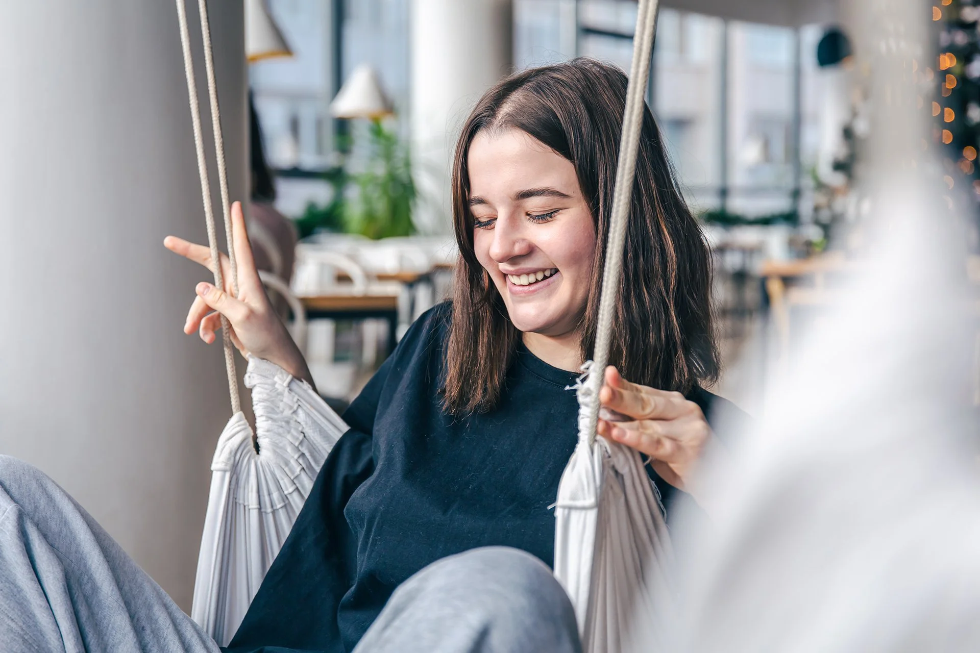 Young person relaxing indoors representing supportive individual therapy