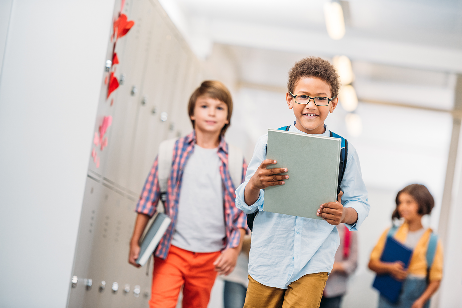 K–12 students walking through school representing psychoeducational testing support for IEPs and 504 Plans