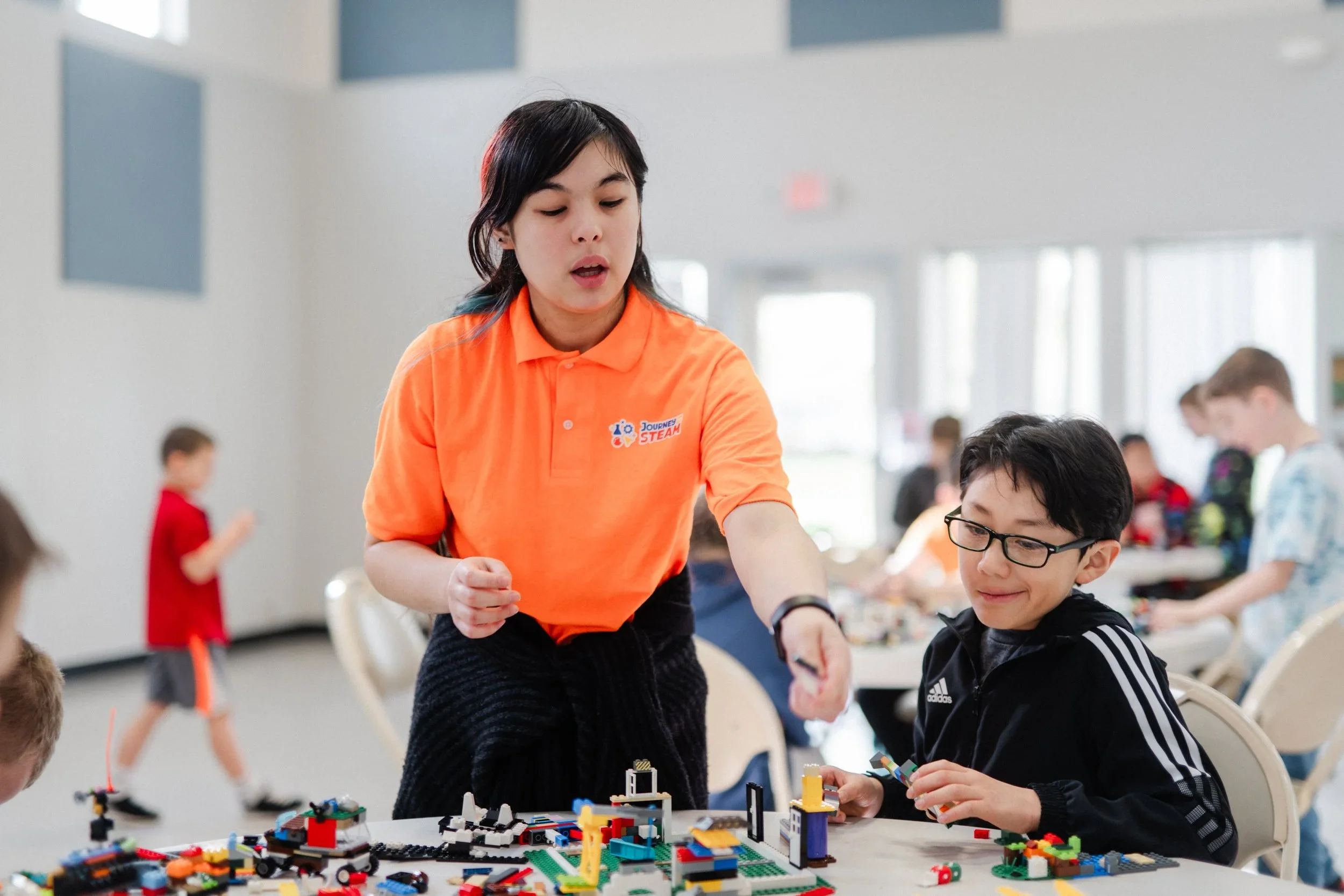 Dr. Arielle Hammond teaching a Journey to STEAM LEGO robotics class